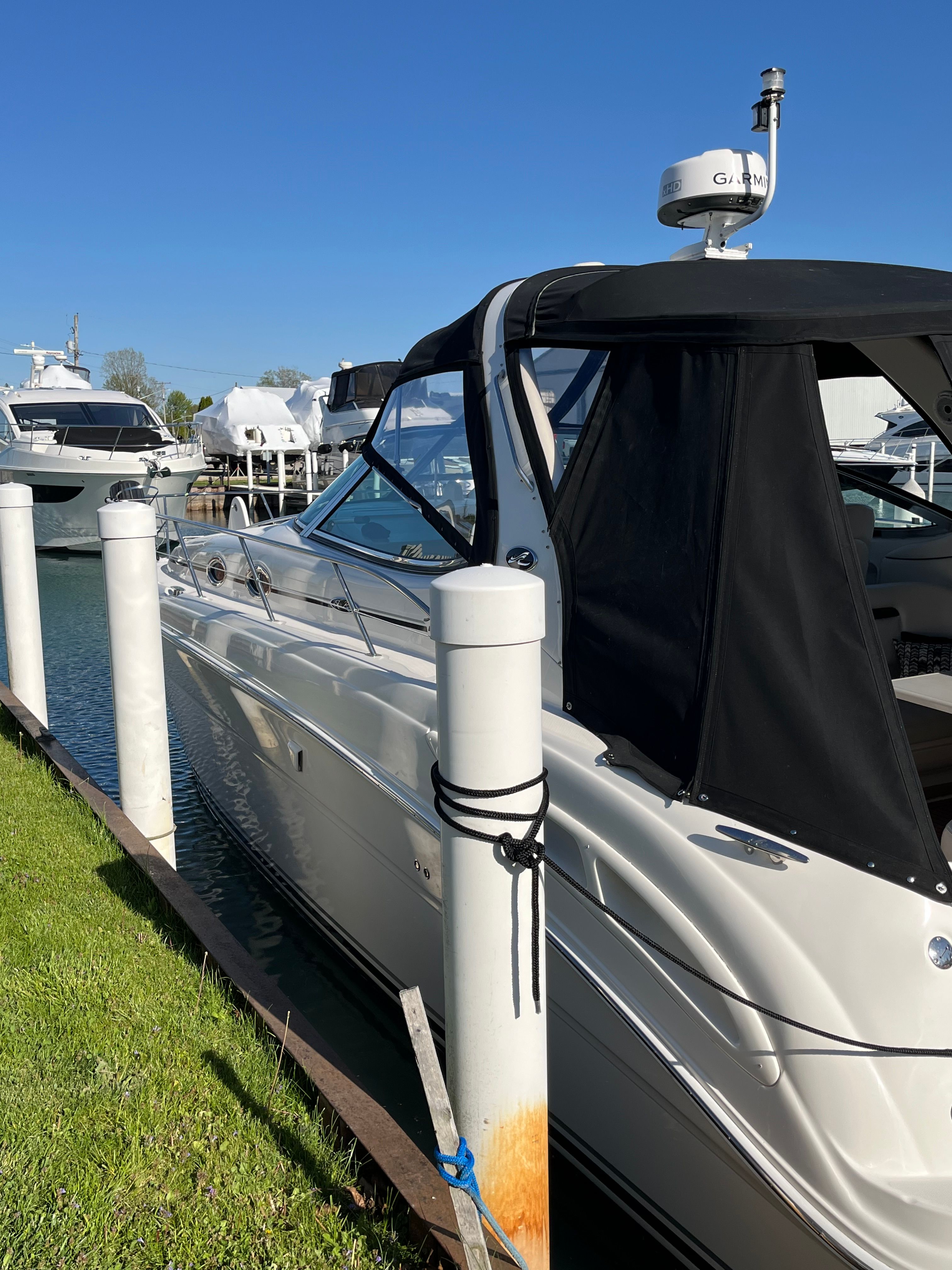 2005 Sea Ray Sundancer yacht docked at marina.