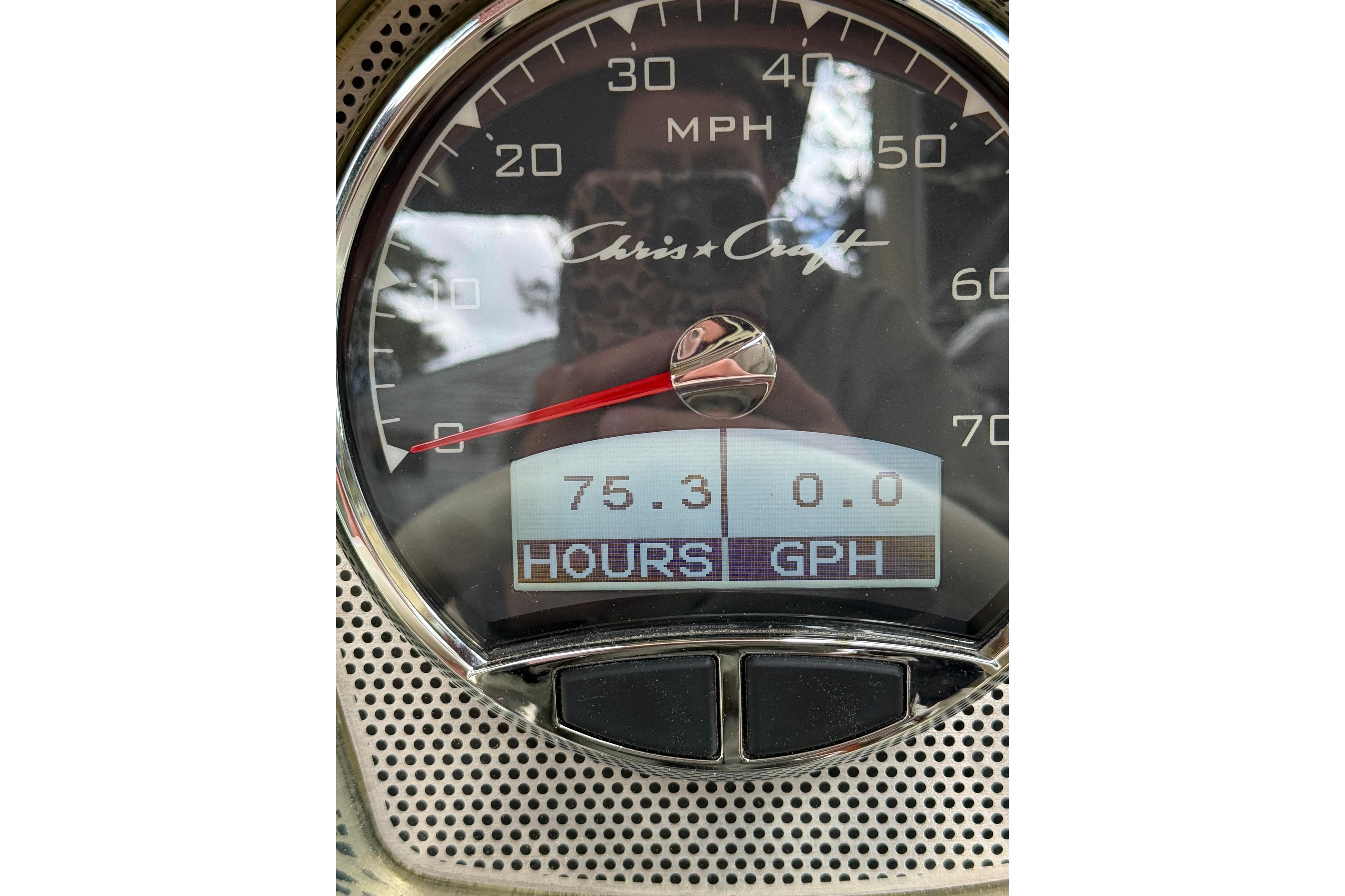 Close-up of 2019 Chris-Craft Launch 28 GT speedometer showing 75.3 hours and 0.0 GPH.