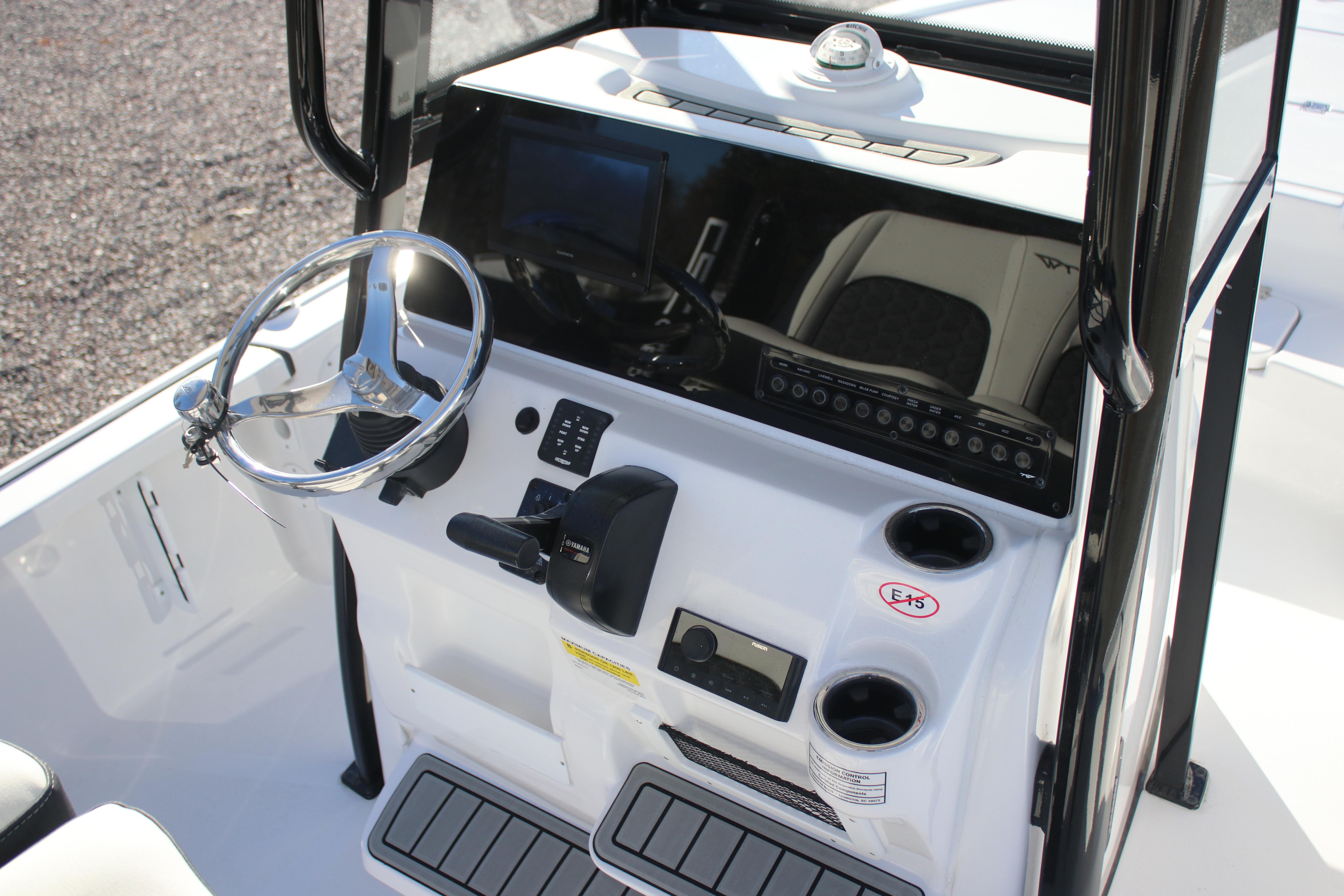 2026 Tidewater 2210 Carolina Bay boat console with steering wheel and controls.