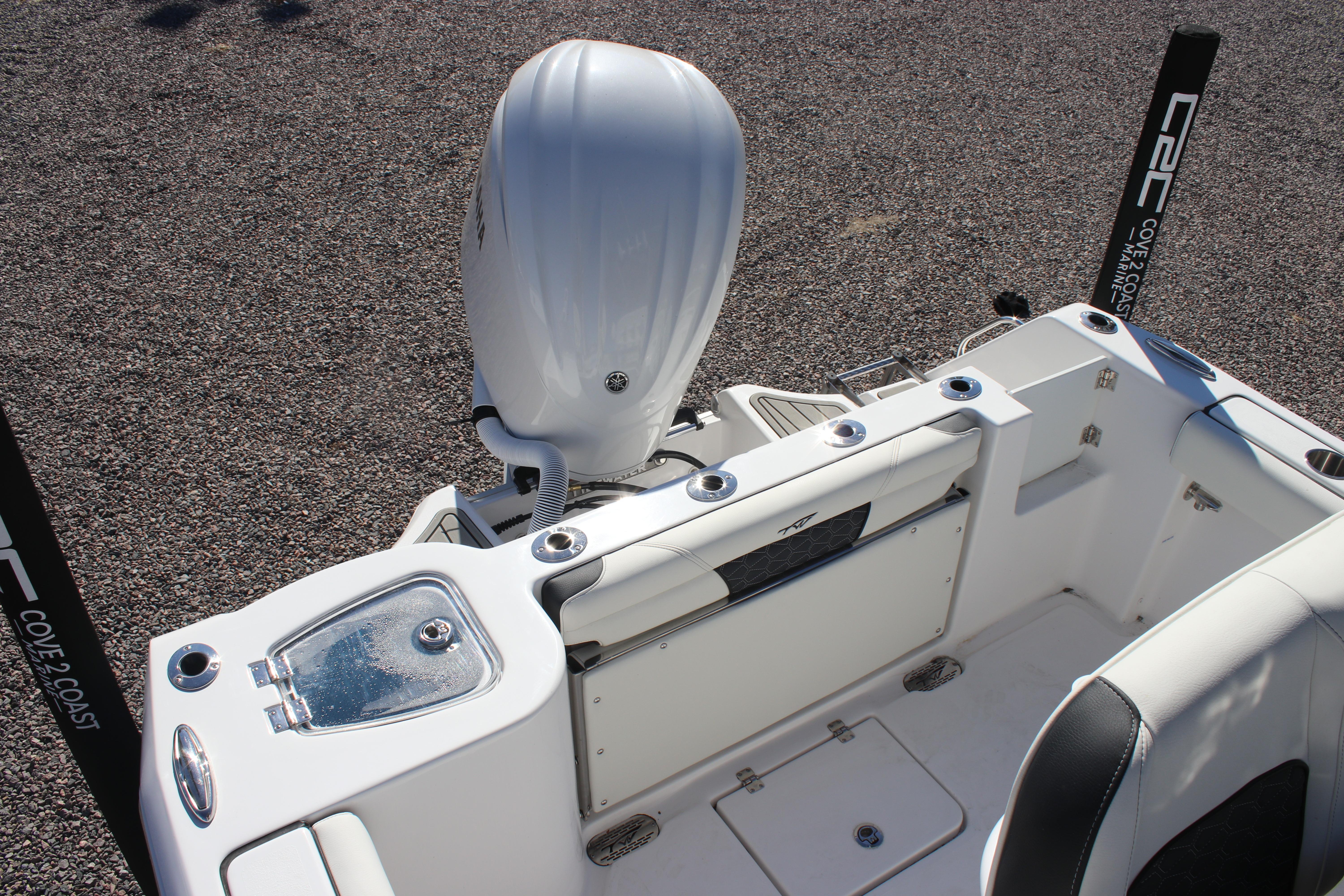 2026 Tidewater 232 CC Adventure boat interior with engine and seating area.