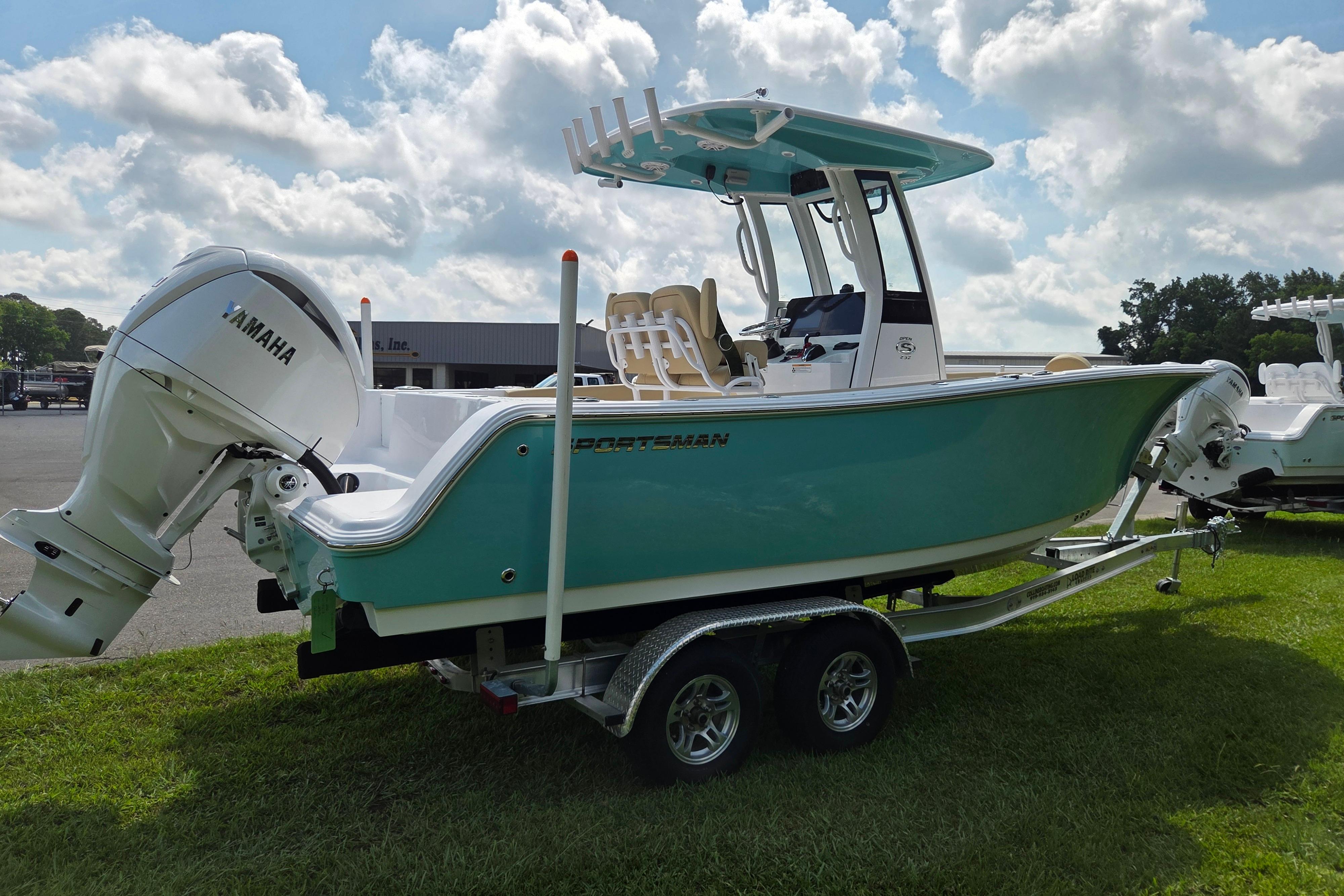 2026 Sportsman Open 232 Center Console boat on trailer, featuring Yamaha outboard motor.