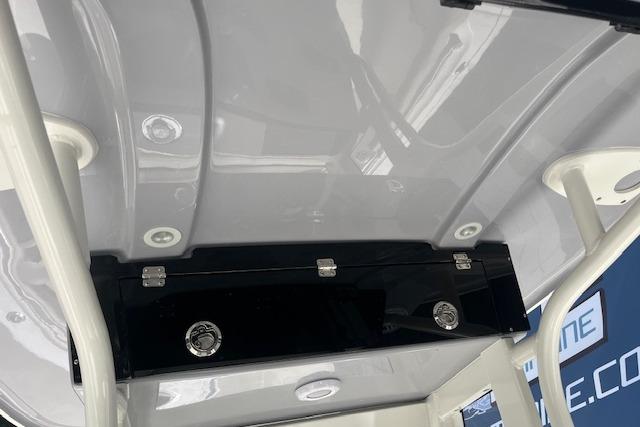 2026 Key West 239 FS boat interior with storage compartment and sleek design.