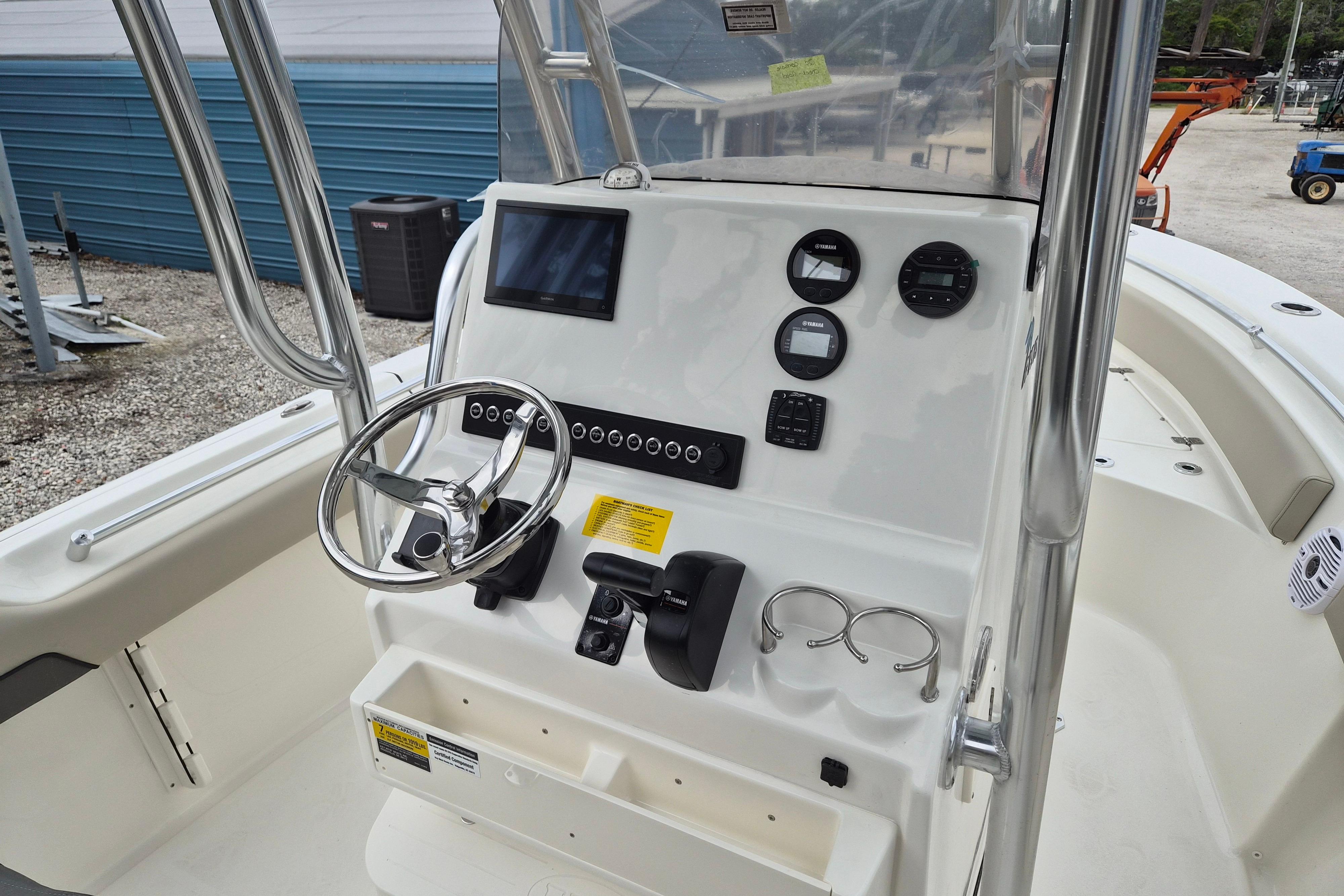 2026 Key West 219 FS boat console with steering wheel and gauges.