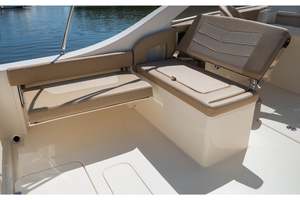 2023 Scout 240 Dorado boat seating area with beige cushions.