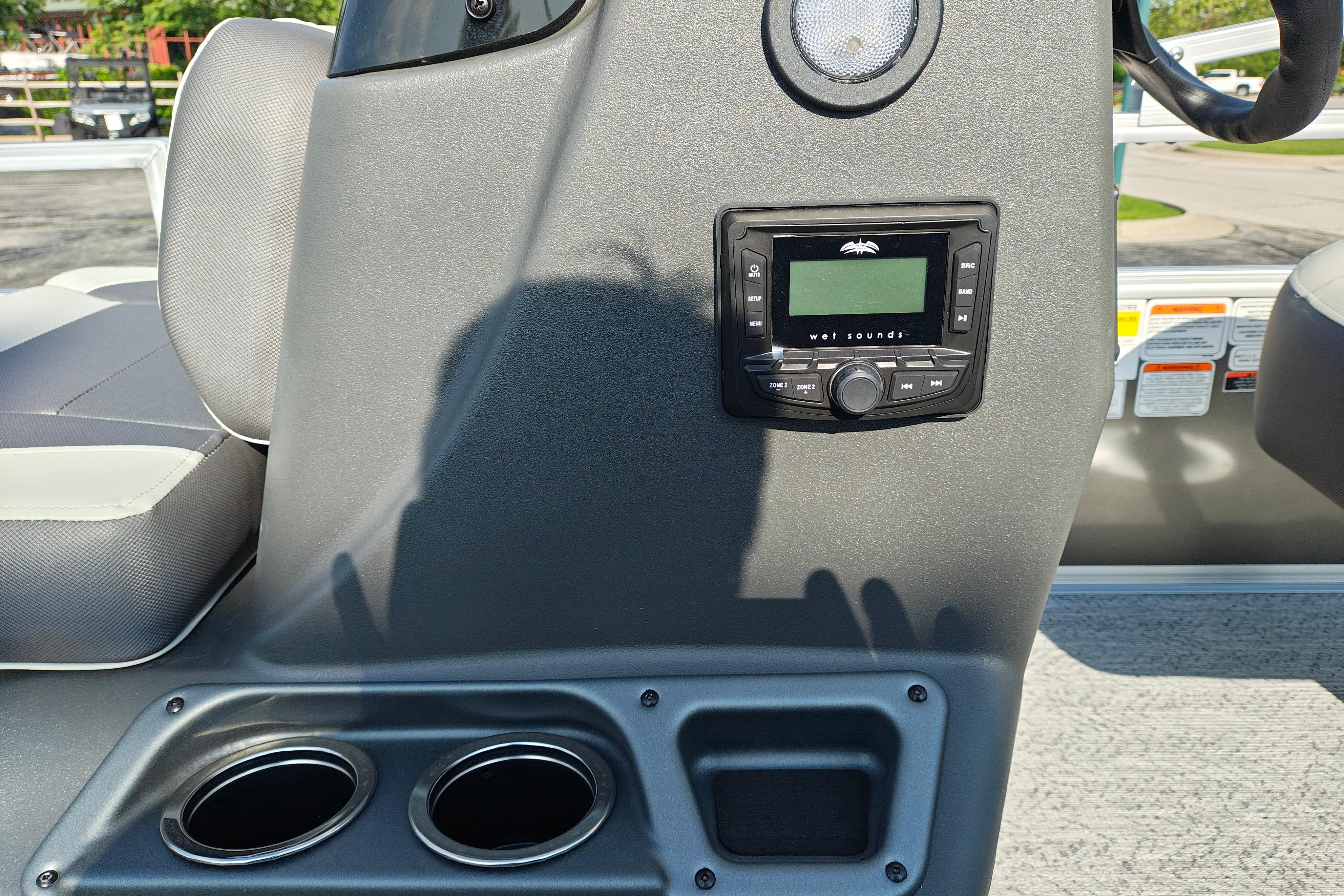 2026 Sun Tracker Bass Buggy 18 DLX console with stereo system and cup holders.