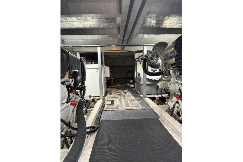 Engine room of a 2007 Navigator 5100 yacht, showcasing mechanical components and equipment.