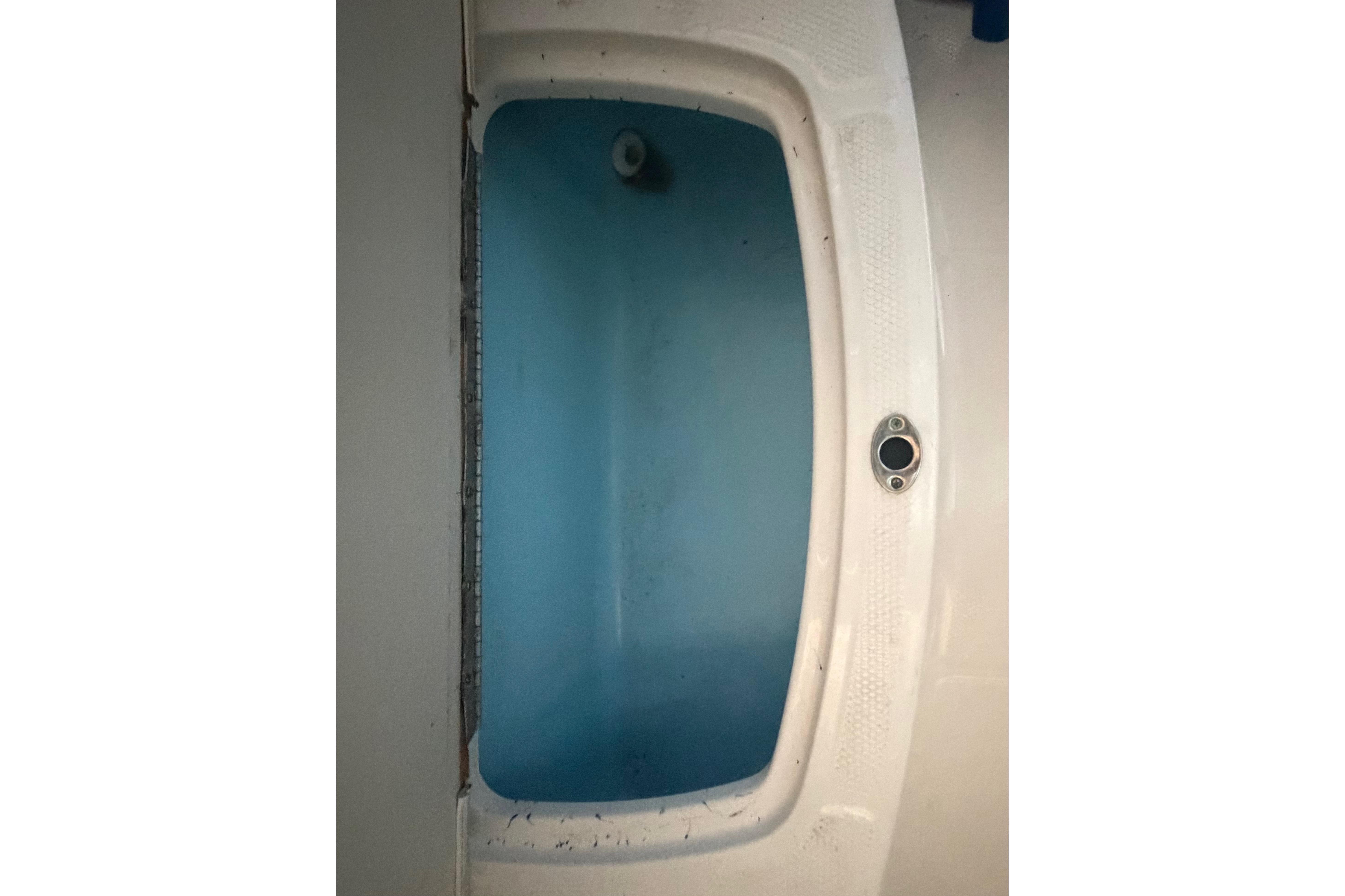 2018 Chaparral 21 H2O Sport boat interior, featuring a blue and white design.