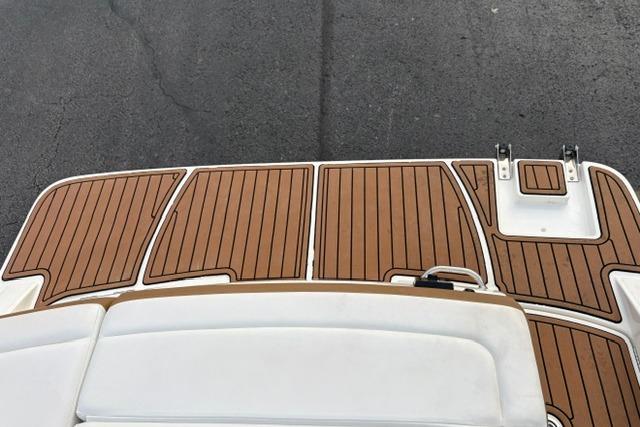 2017 Searay SPX210 boat deck with teak-style flooring and swim platform.