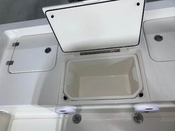 Key West 188 Bay Reef 2026 boat storage compartments with open lid, showcasing interior space.