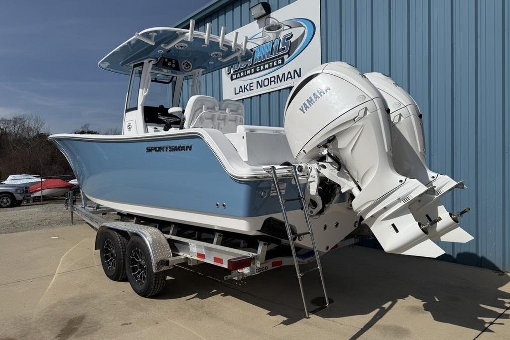 2026 Sportsman Open 252 Center Console boat with dual Yamaha engines on a trailer.