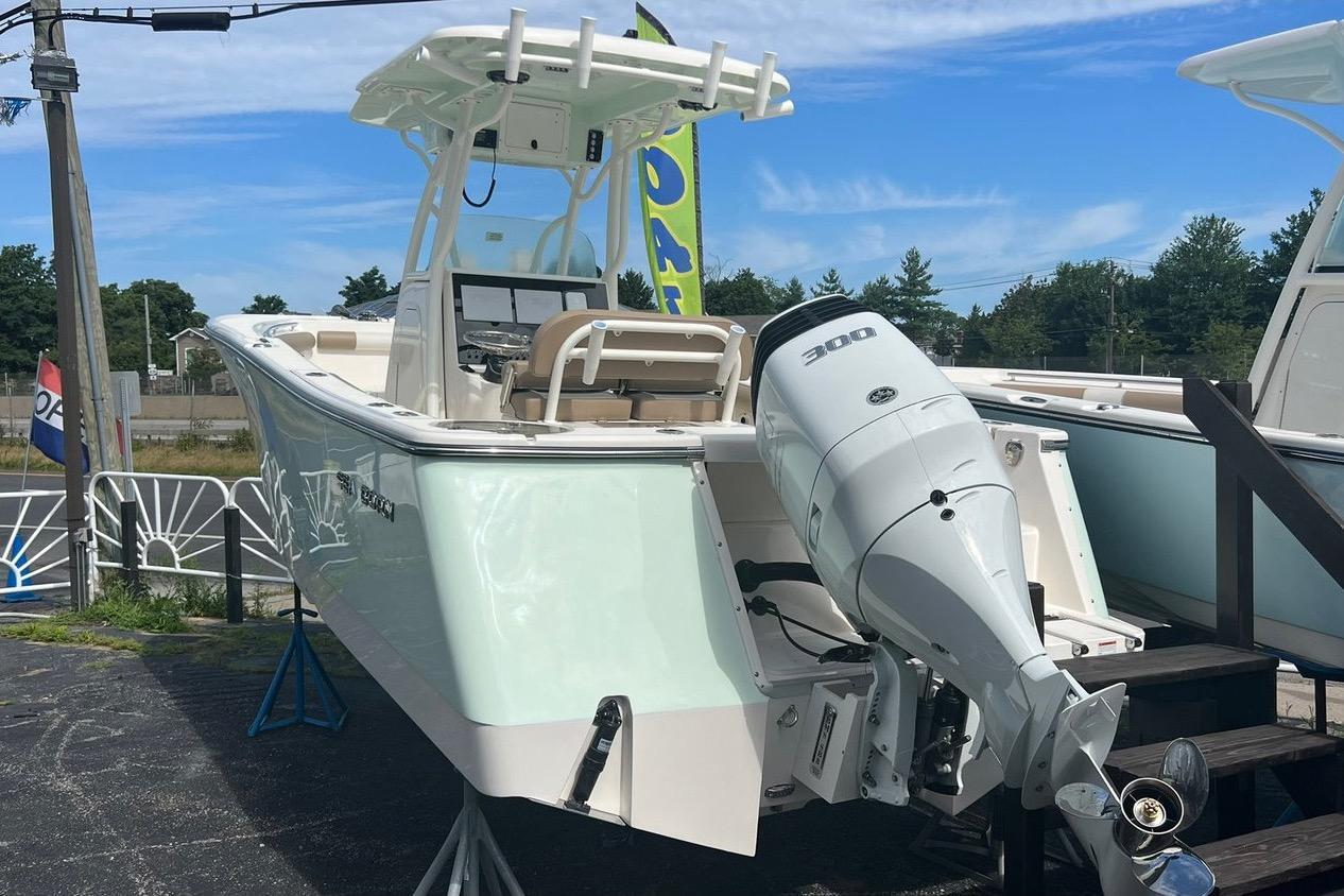 2023 Sea Born SX239 Offshore boat with powerful 300 HP engine displayed outdoors.