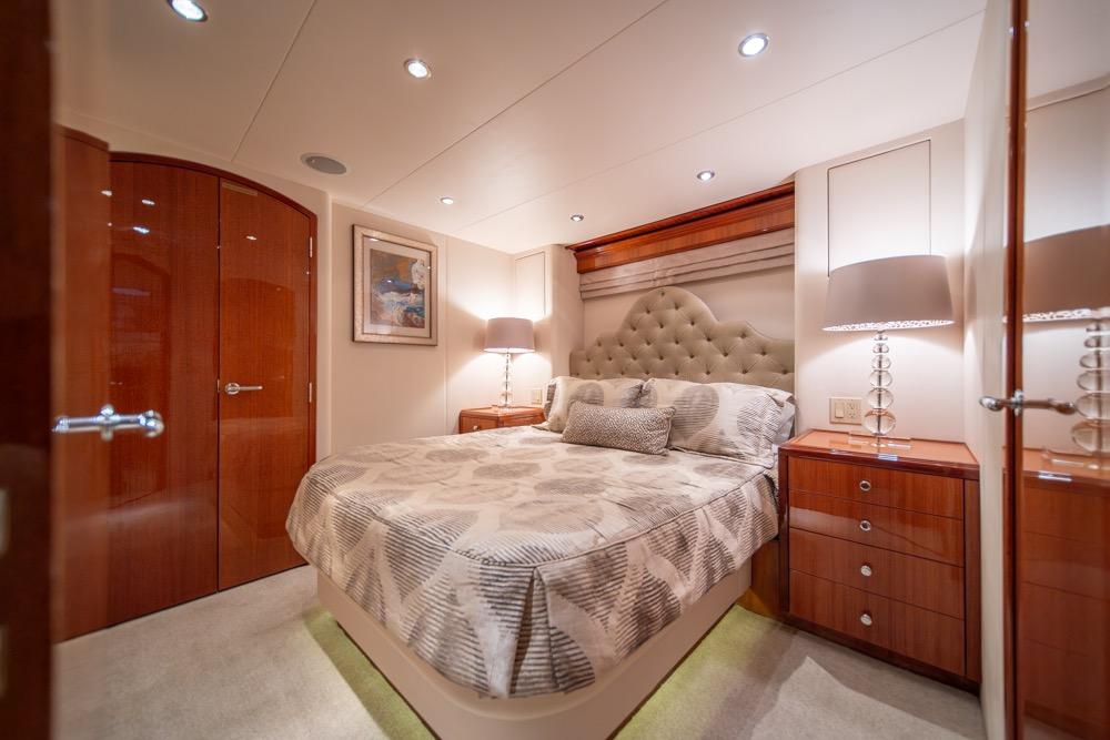 Luxurious bedroom interior of 2008 Hatteras 72 Motor Yacht with elegant decor and lighting.