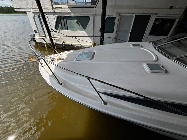 2002 Bayliner 2855 boat docked by the water.