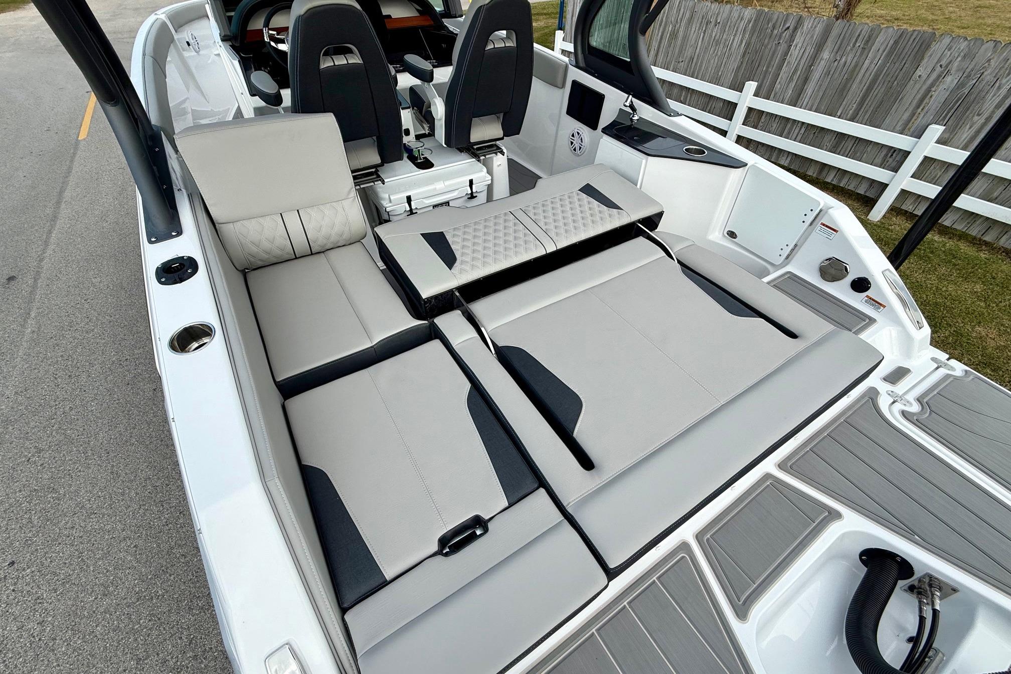 2026 Monterey Elite 25 OB boat interior with luxurious seating and modern design.