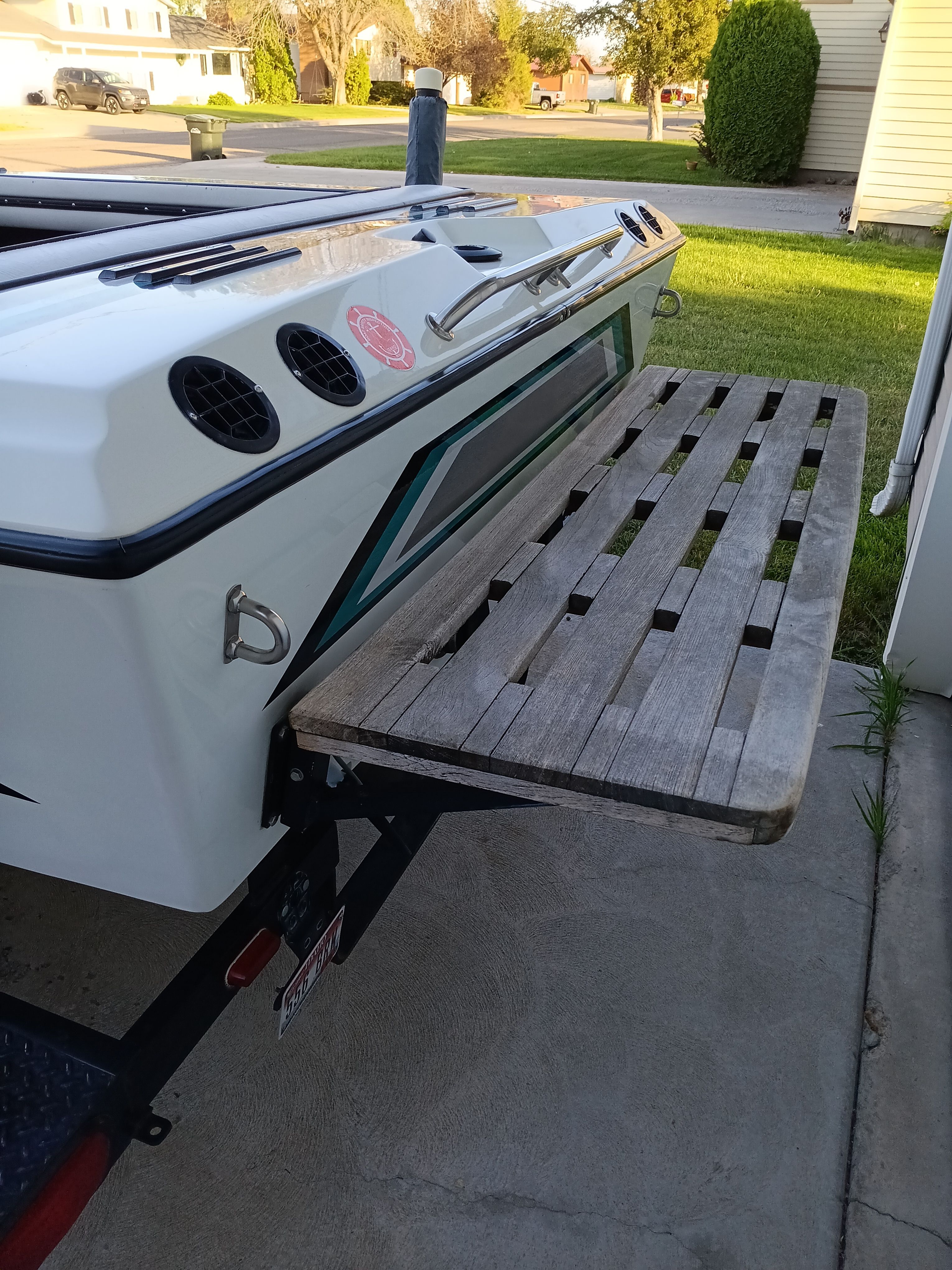 1991 Malibu Skier boat with wooden platform outdoors.