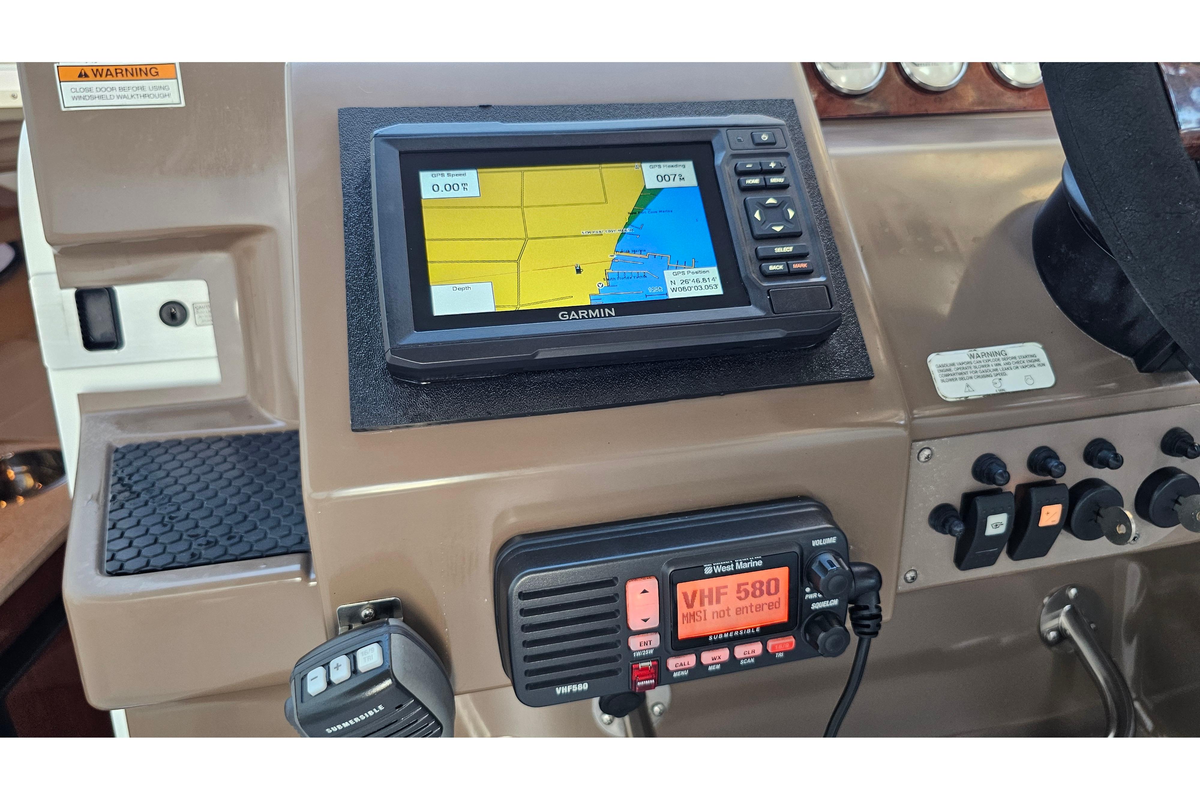 Dashboard of a 2005 Regal 3060 Window Express with Garmin GPS and VHF radio.