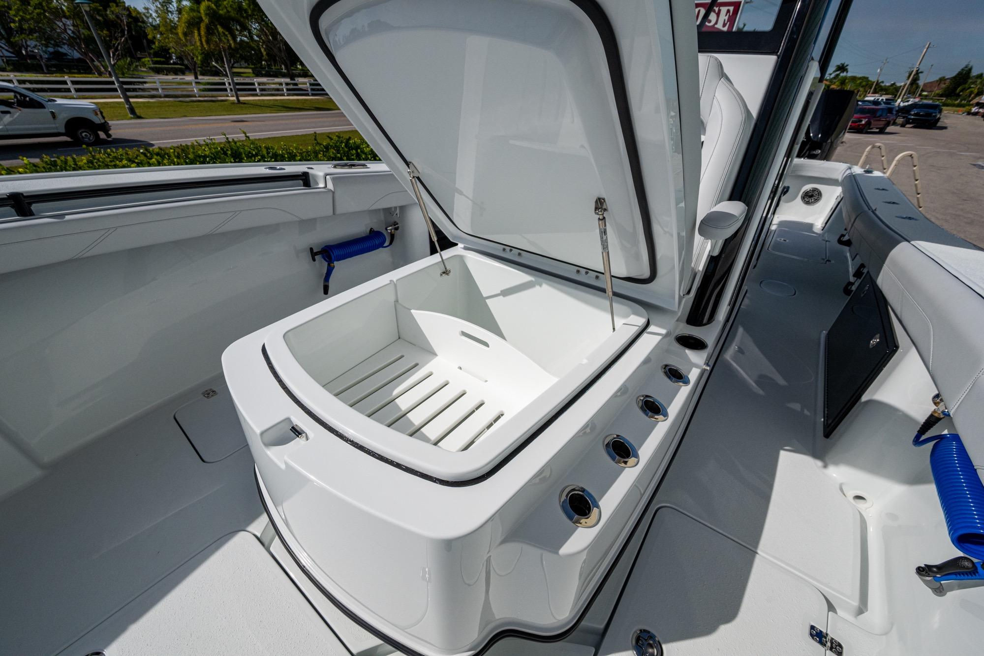 2026 Yellowfin 36 Offshore boat interior with open storage compartment.