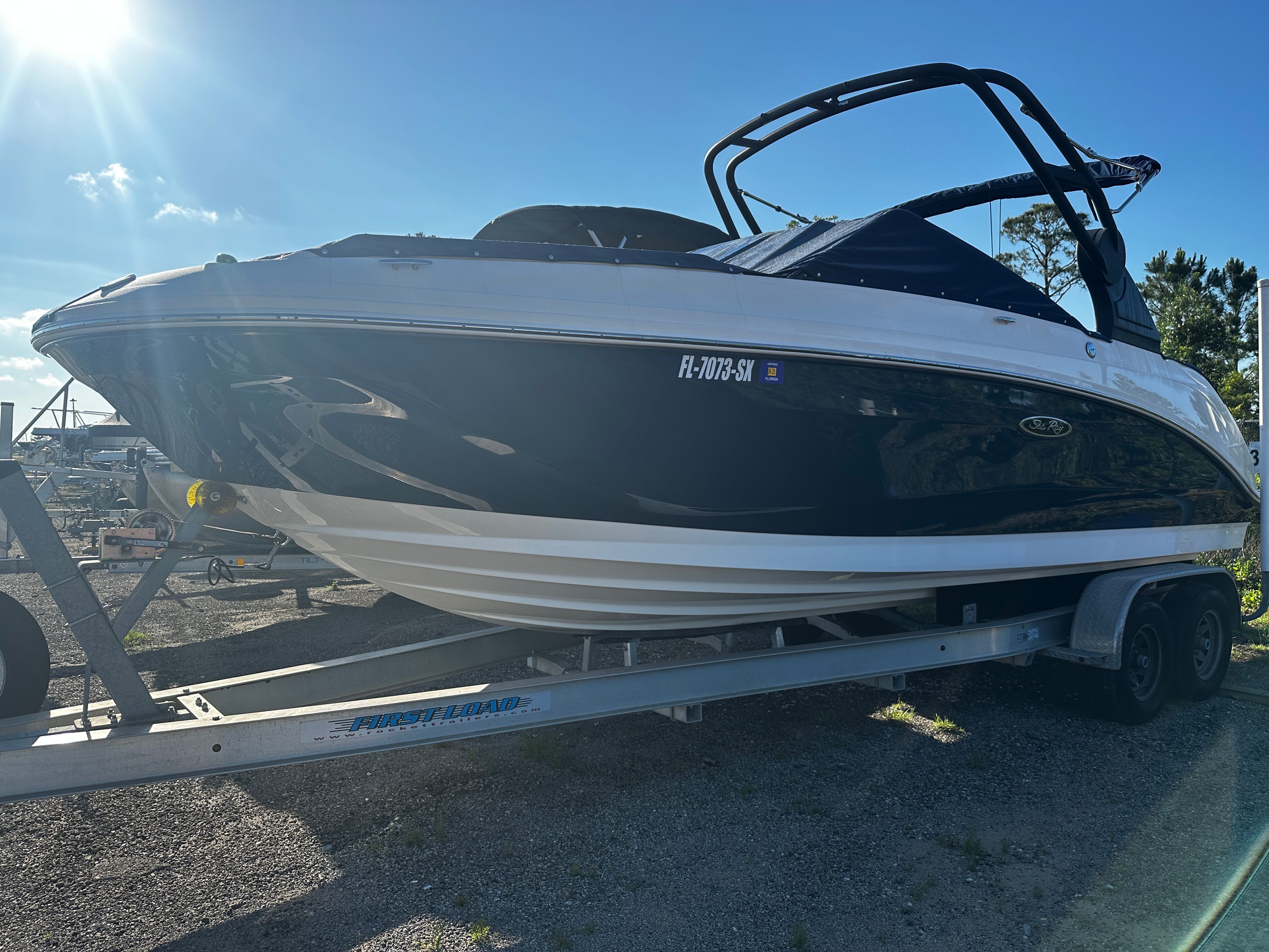 2020 Sea Ray SDX 250 Outboard on trailer in sunlight.