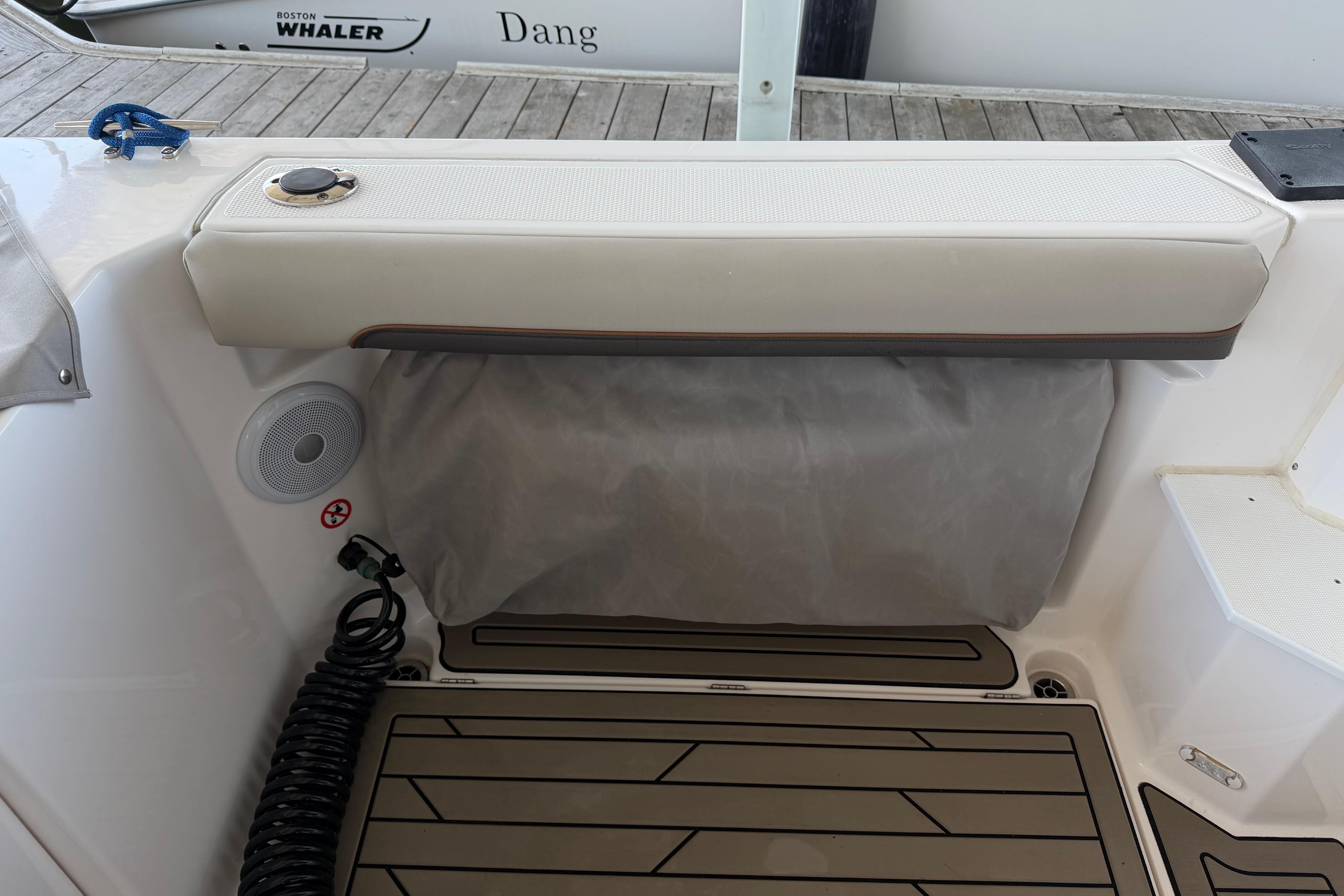2023 Cutwater C-288 Coupe boat interior with cushioned seating and speaker system.