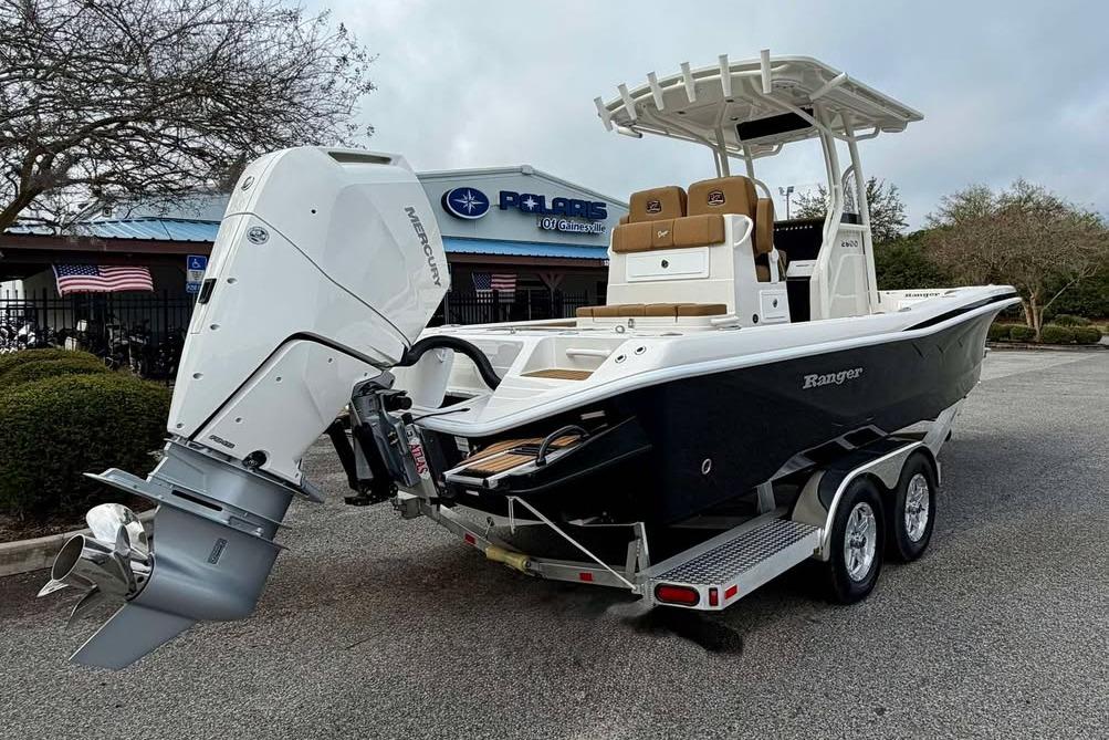 2026 Ranger 2600 Bay boat on trailer with Mercury outboard engine, parked outdoors.