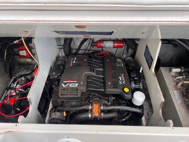 Engine compartment of a 1999 Crownline 266 CCR with V8 engine.