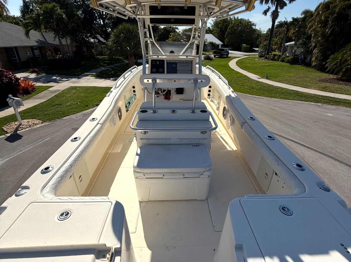 2004 World Cat 270TE boat parked on a street.