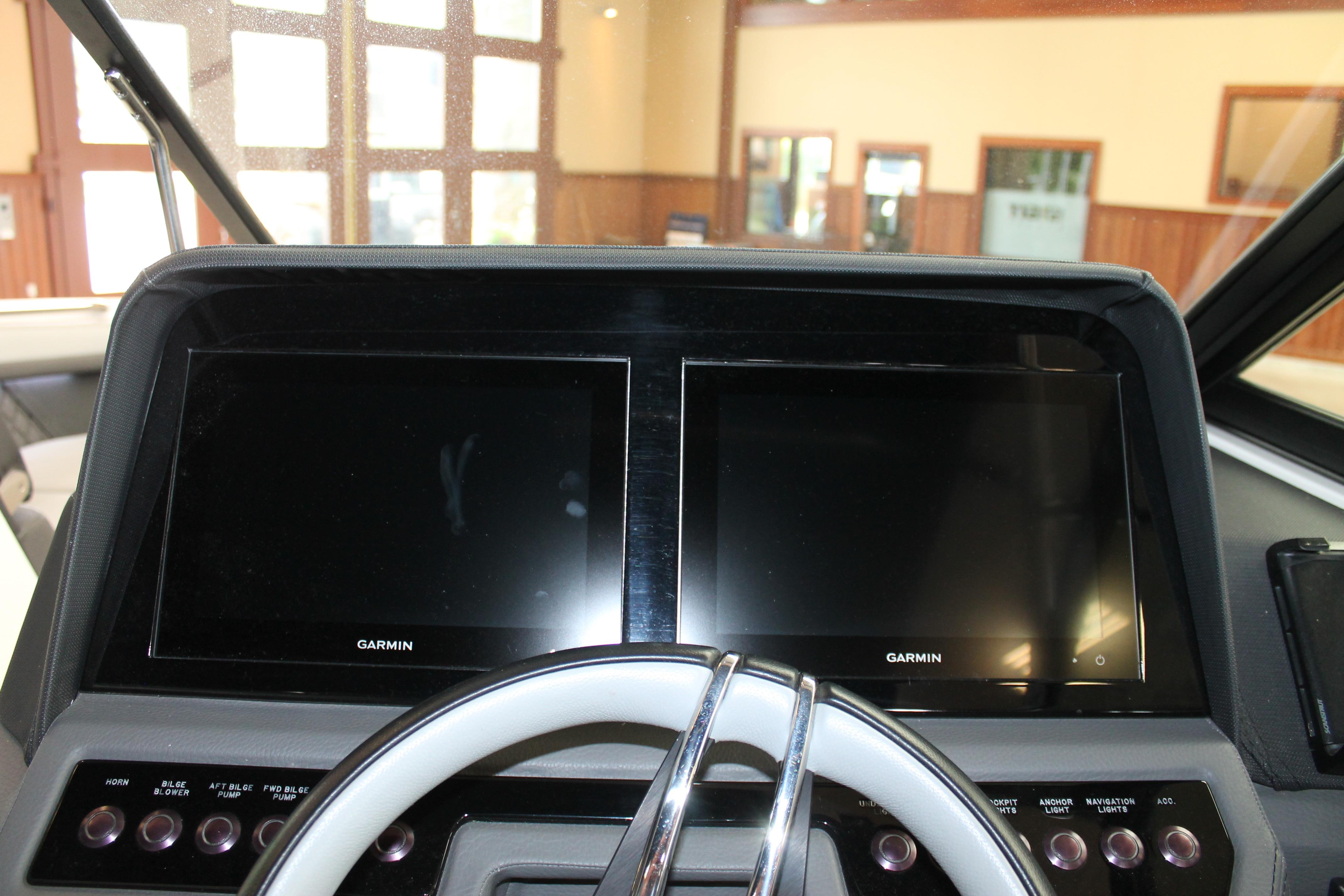 2023 Cobalt R8 dashboard with dual Garmin displays and steering wheel.