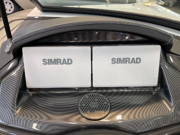 Simrad navigation displays on 2025 Monterey 218 SS boat dashboard.