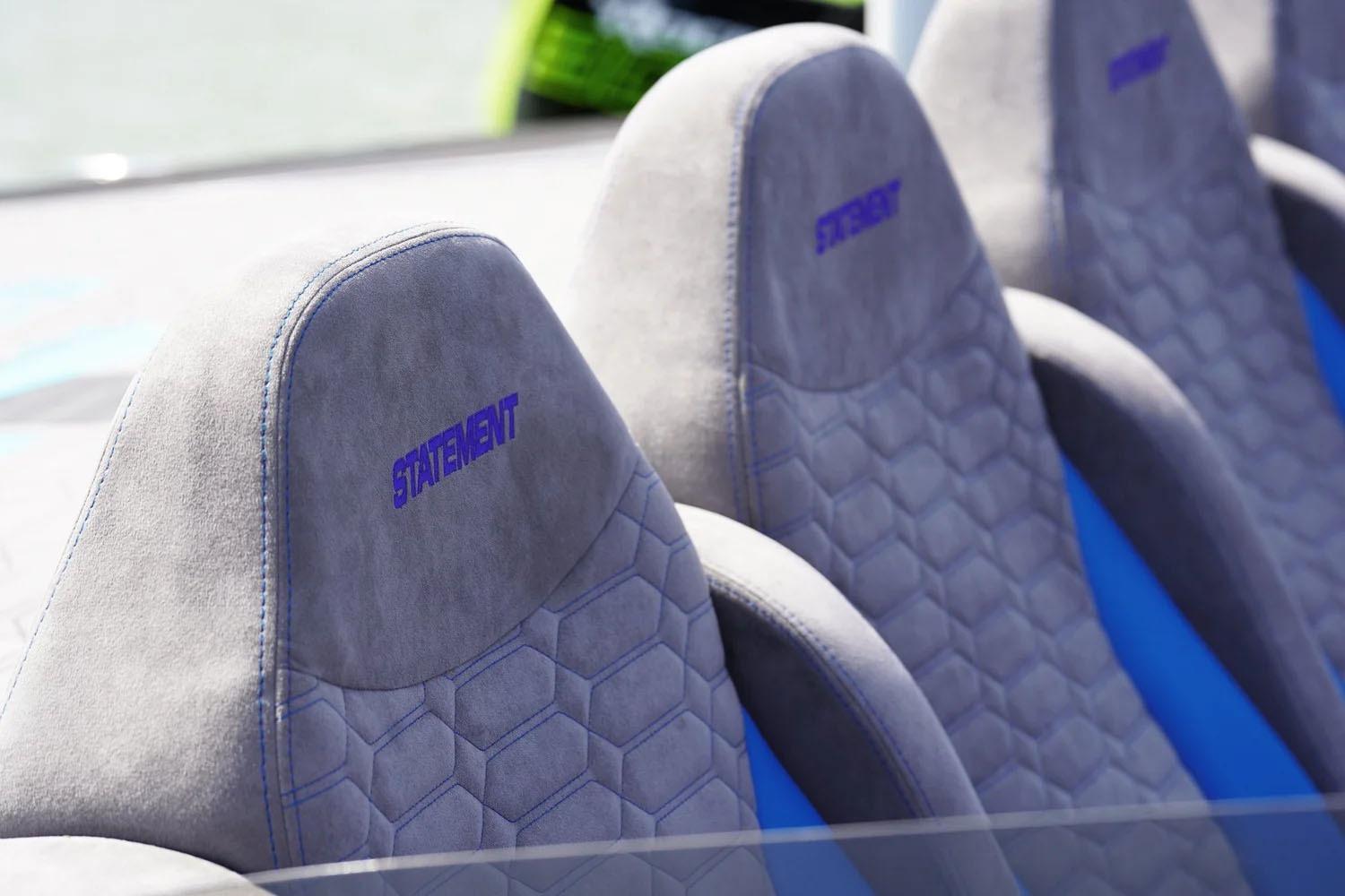 Manufacturer Provided Image: Luxurious seats in the 2026 Statement 360 CAT with hexagonal pattern and blue stitching.
