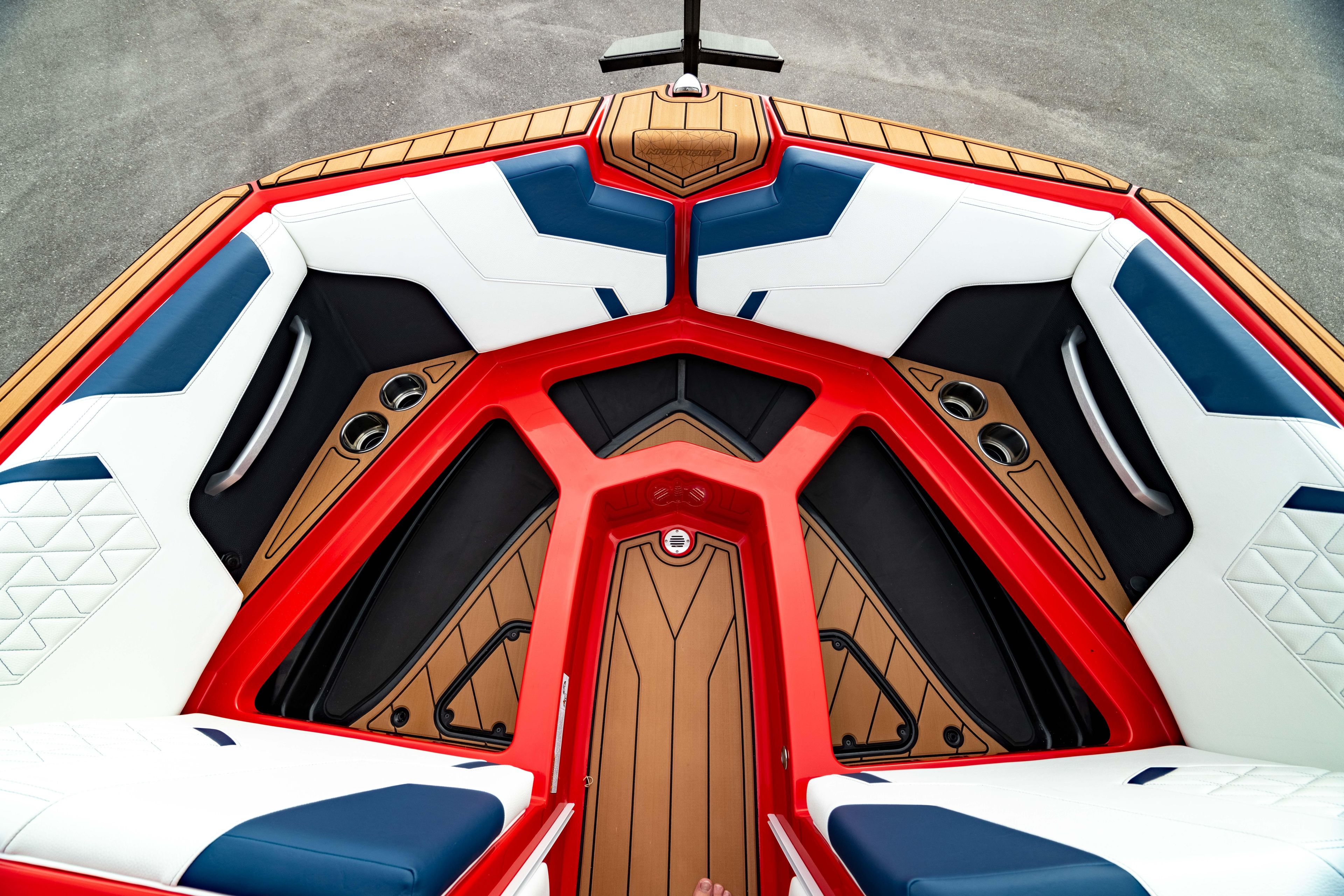 2025 Nautique Super Air Nautique GS20 boat interior with red, white, and blue seating.