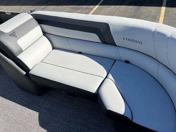 The 2023 Viaggio Lago 22U Tri Toon features a sleek gray and black seating area.