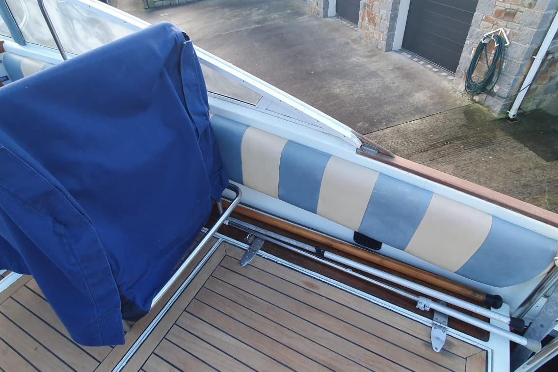 1989 Fairey Spearfish MKIII boat interior with blue cover and striped seating.