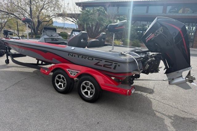 2026 Nitro Z21 XL boat with red accents and dual-axle trailer.