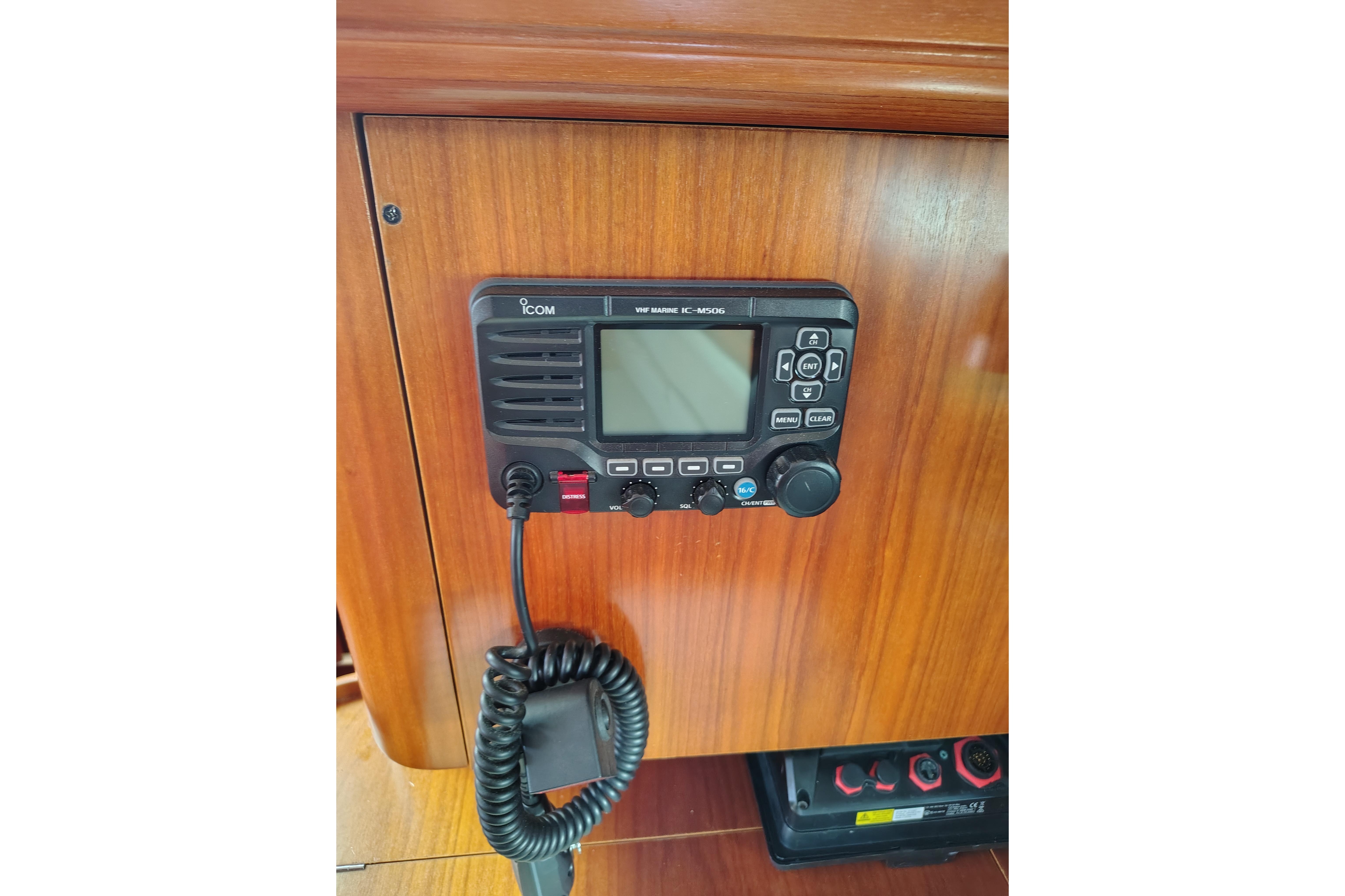VHF marine radio on 2001 Beneteau Oceanis 411 yacht's wooden interior panel.