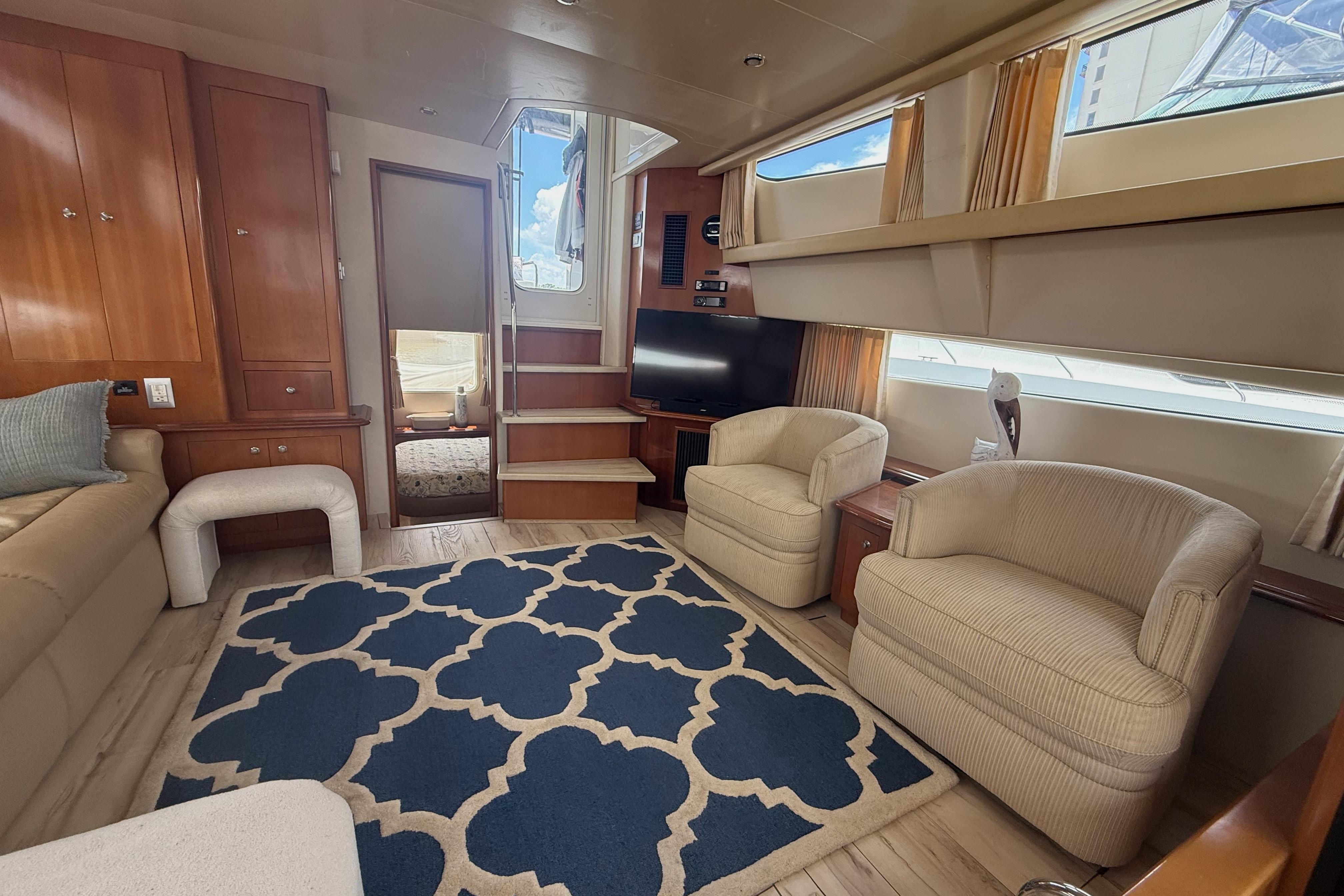 Luxurious interior of 2006 Carver 43 Motor Yacht with plush seating and elegant decor.