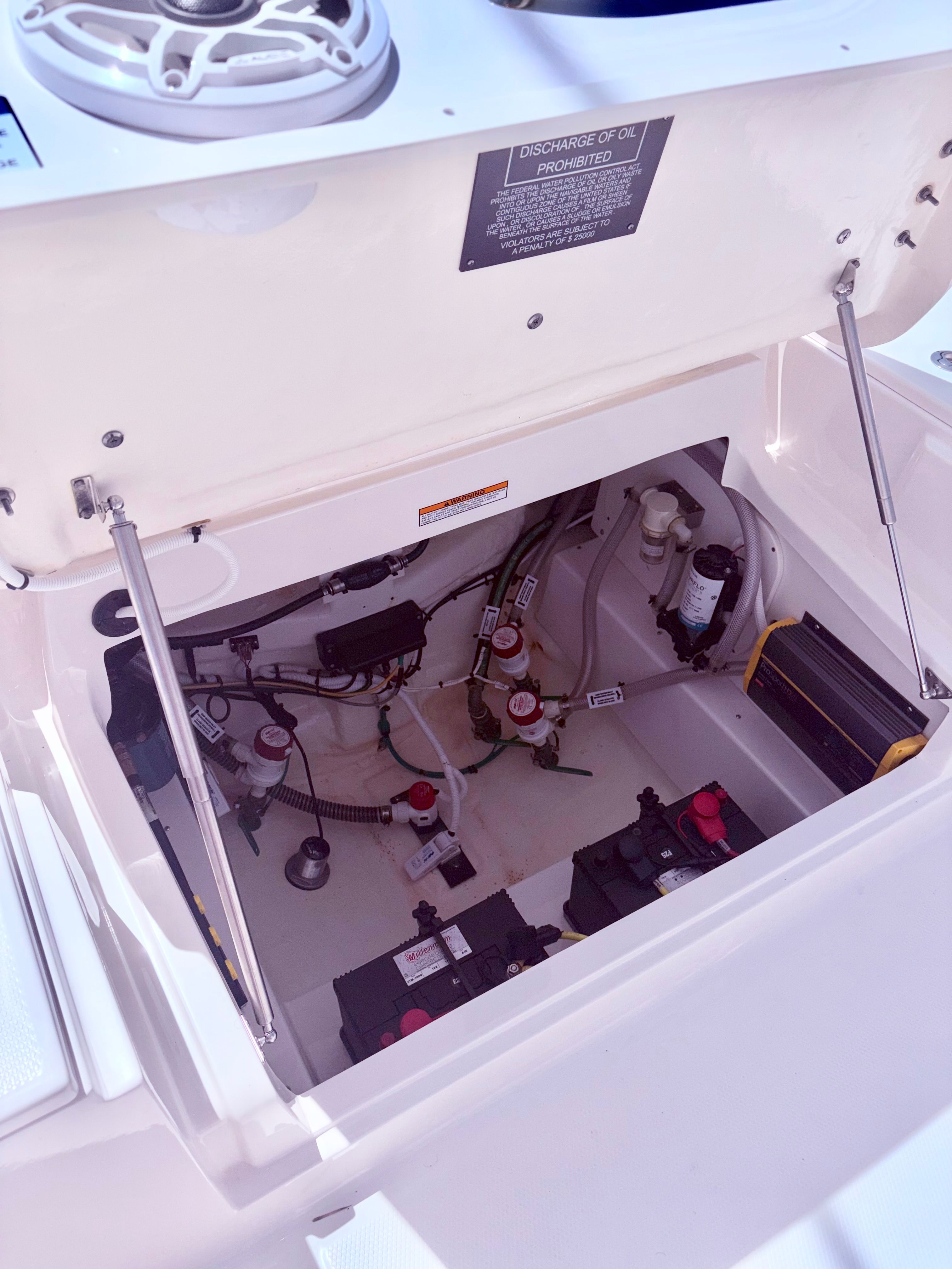 View of the engine compartment in a 2025 Robalo 266 Cayman boat.