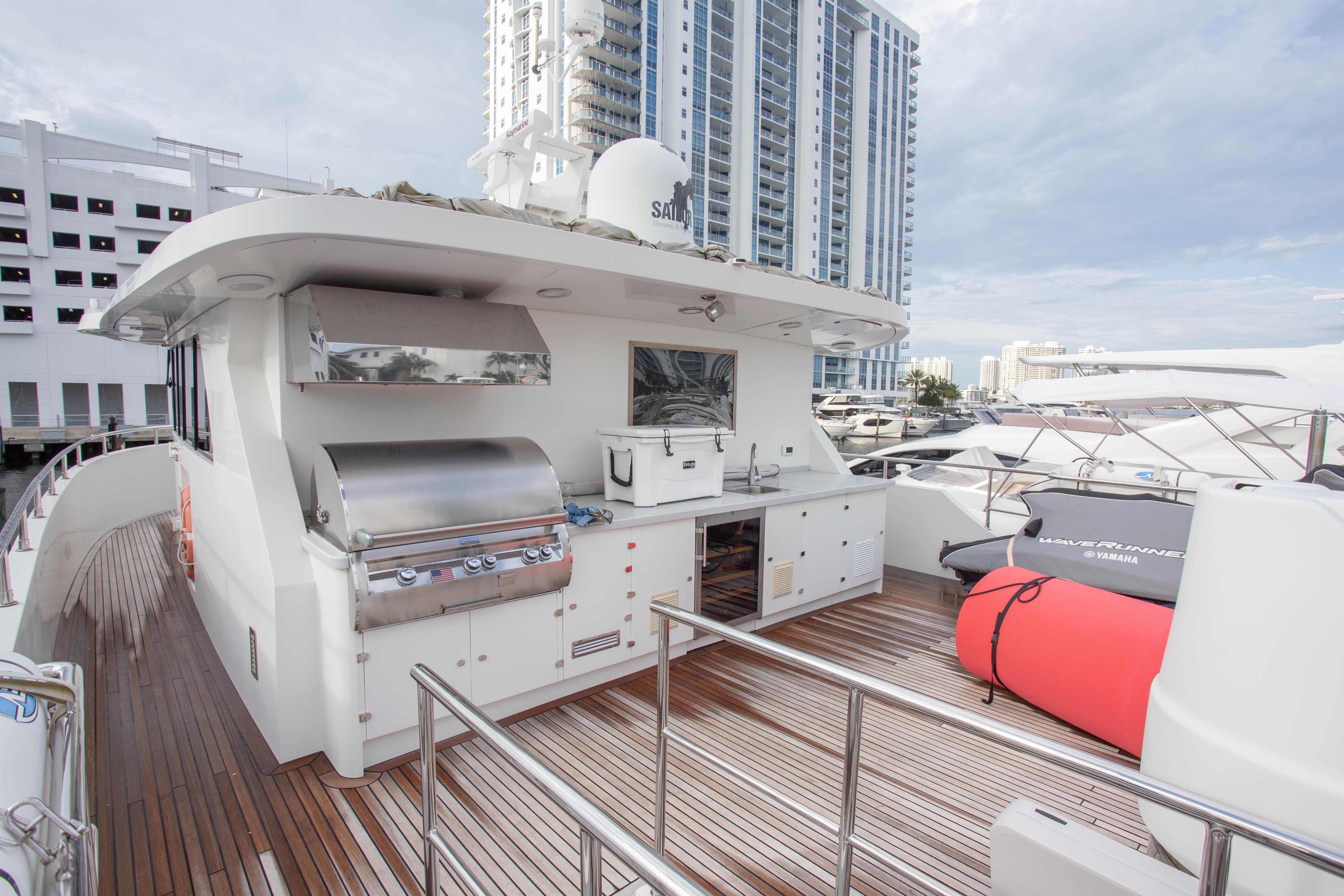 Luxurious 2014 Fifth Ocean Yachts 24m Explorer Yacht with outdoor kitchen and modern amenities.
