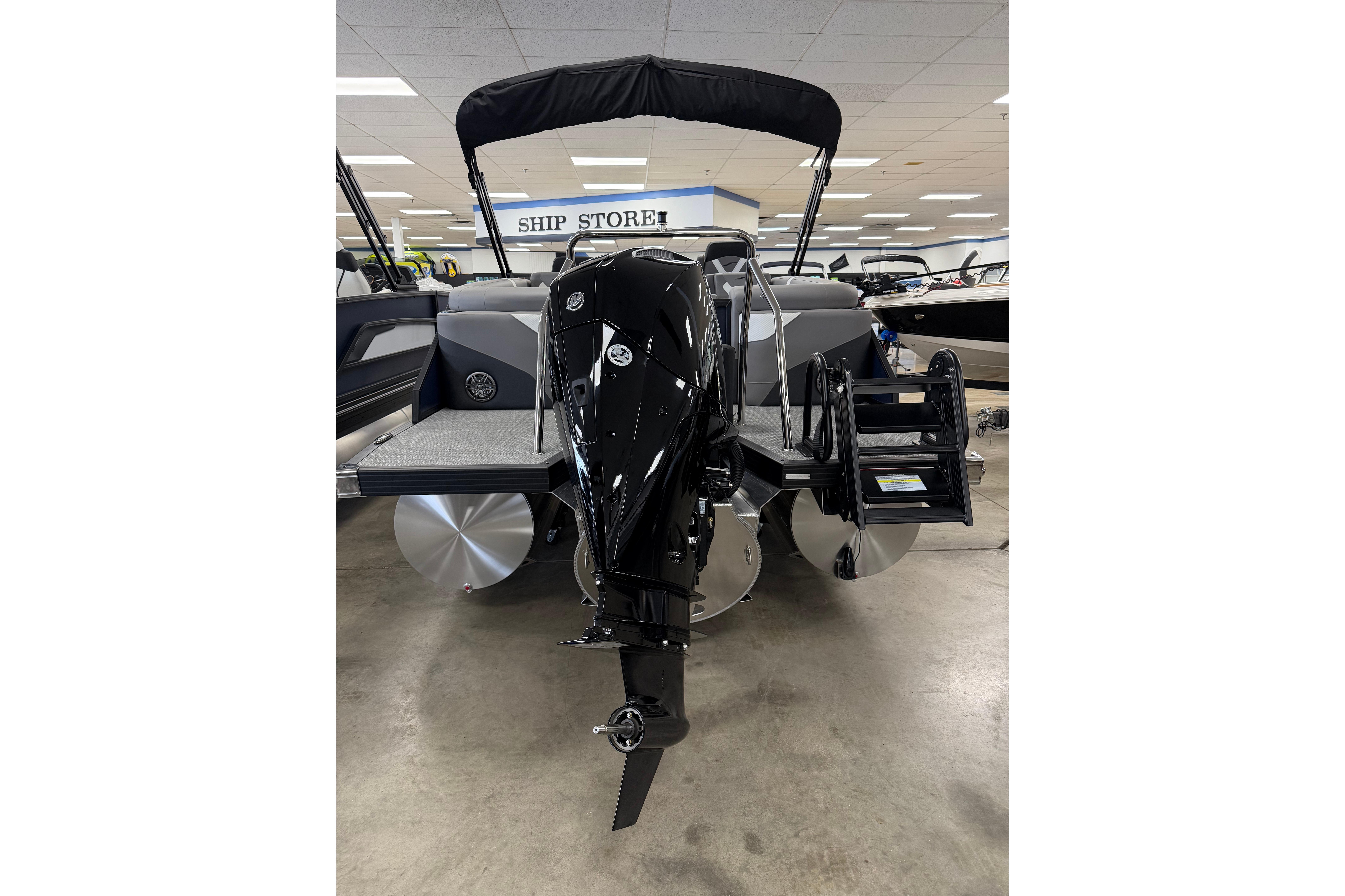 Evotti 523QL 2026 model boat with outboard motor in showroom.