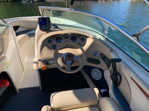 Interior view of a 2000 Sea Ray 210 Bow Rider boat's helm and dashboard.