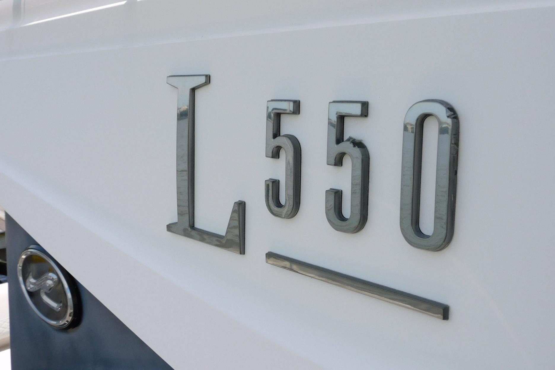 2019 Sea Ray L550 yacht model emblem on white hull.
