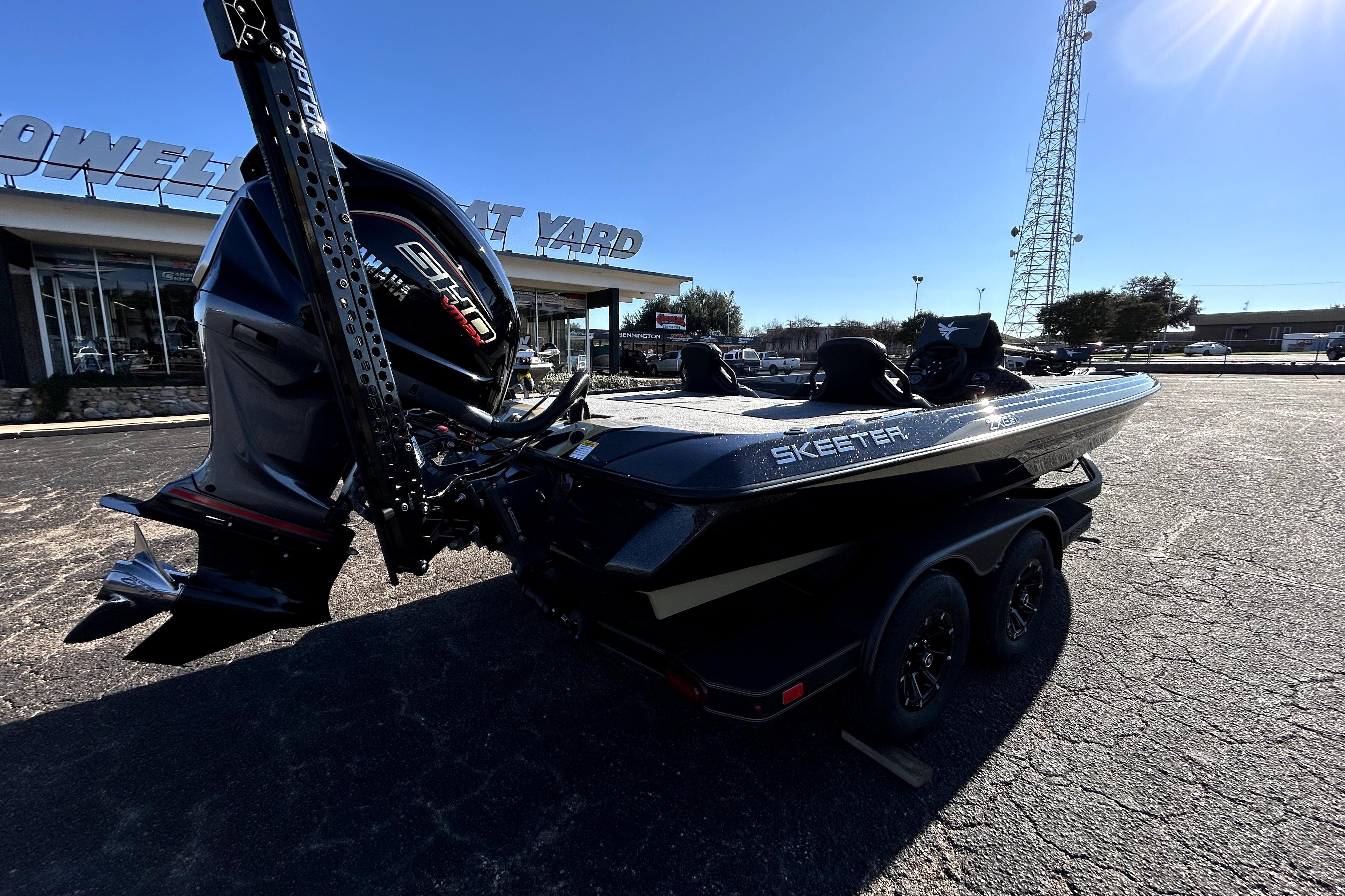 2026 Skeeter ZXE21 boat with powerful engine, parked outside dealership.