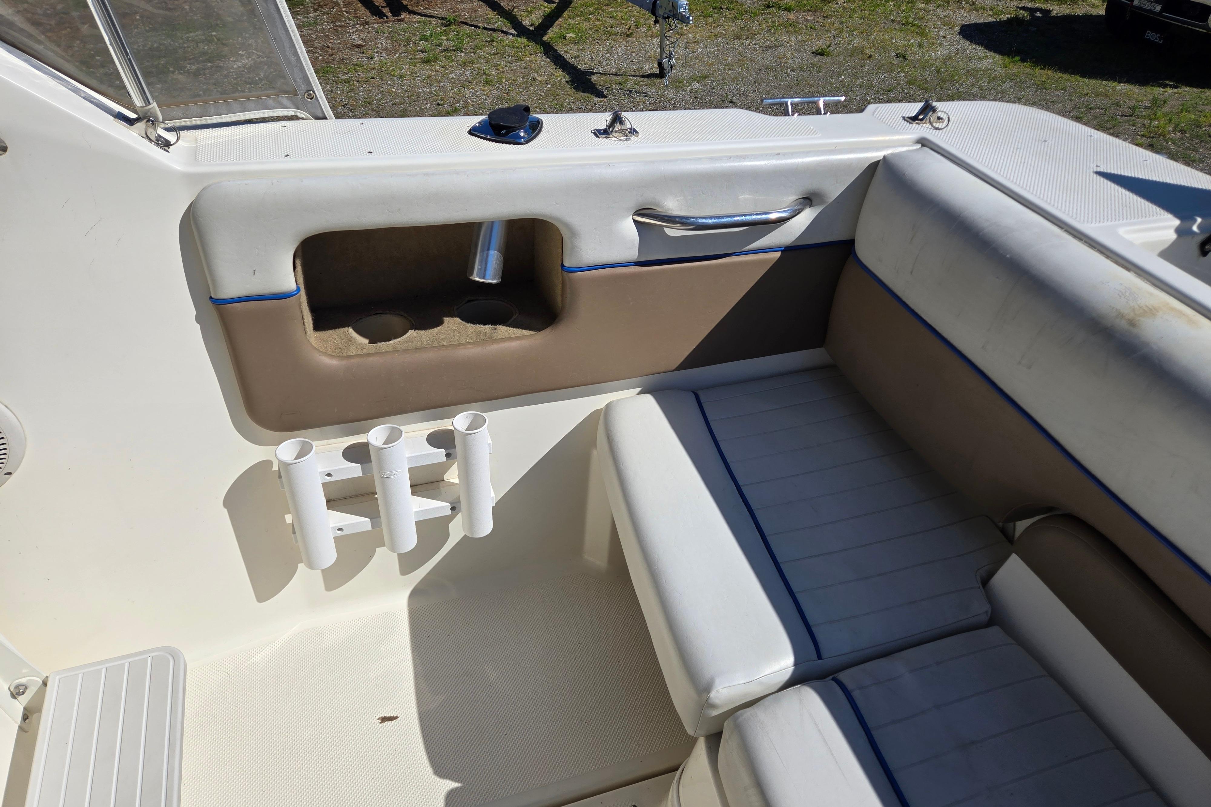 Interior of a 2006 Bayliner 222 Classic boat with seating and storage compartments.