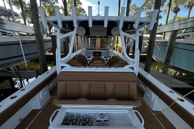 2024 Invincible 46 Catamaran with luxurious seating and modern amenities docked in a marina.