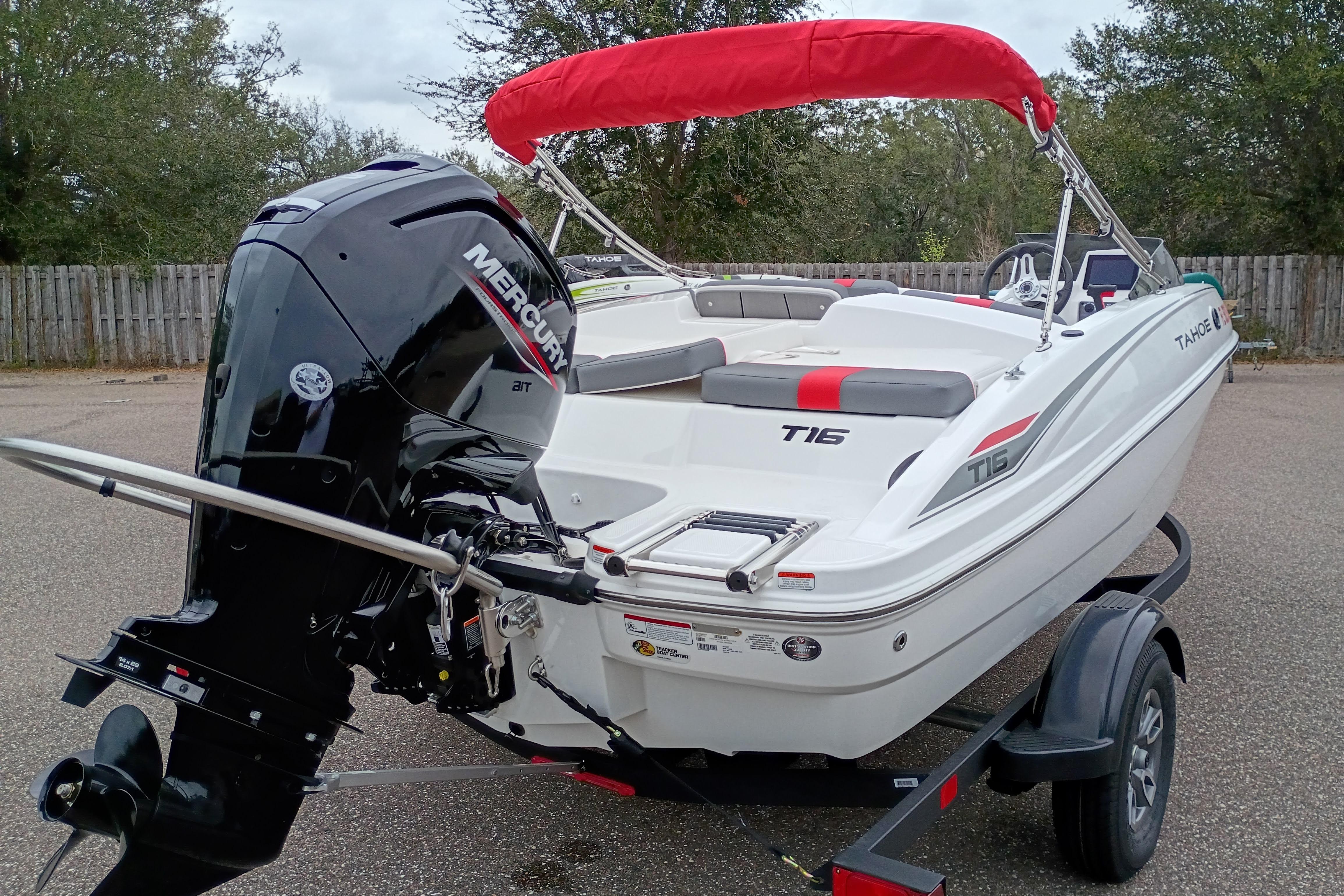 2026 Tahoe T16 boat with Mercury outboard engine and red canopy on trailer.