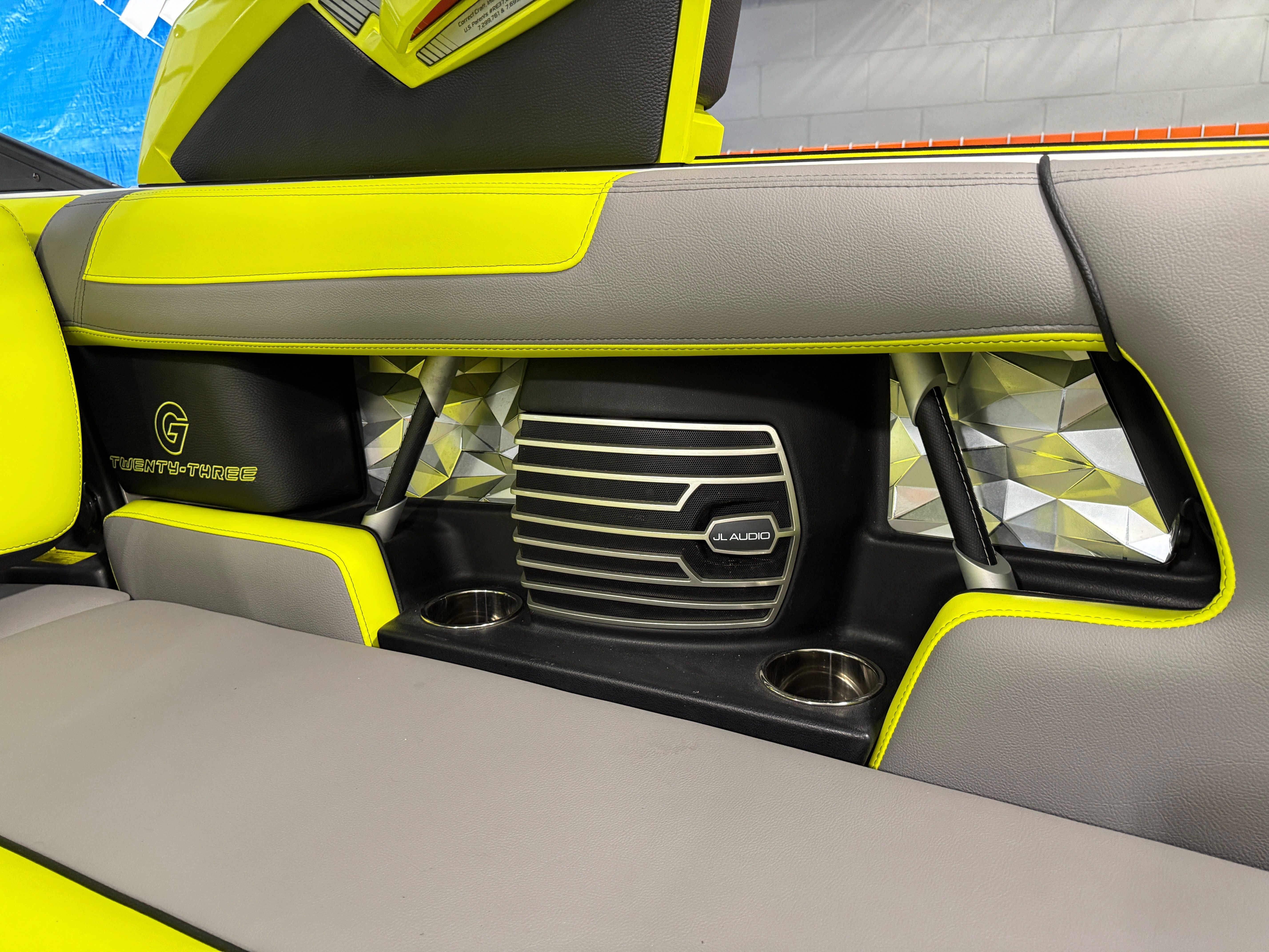 Interior of a 2016 Nautique Super Air Nautique G23 with bright yellow and gray upholstery.