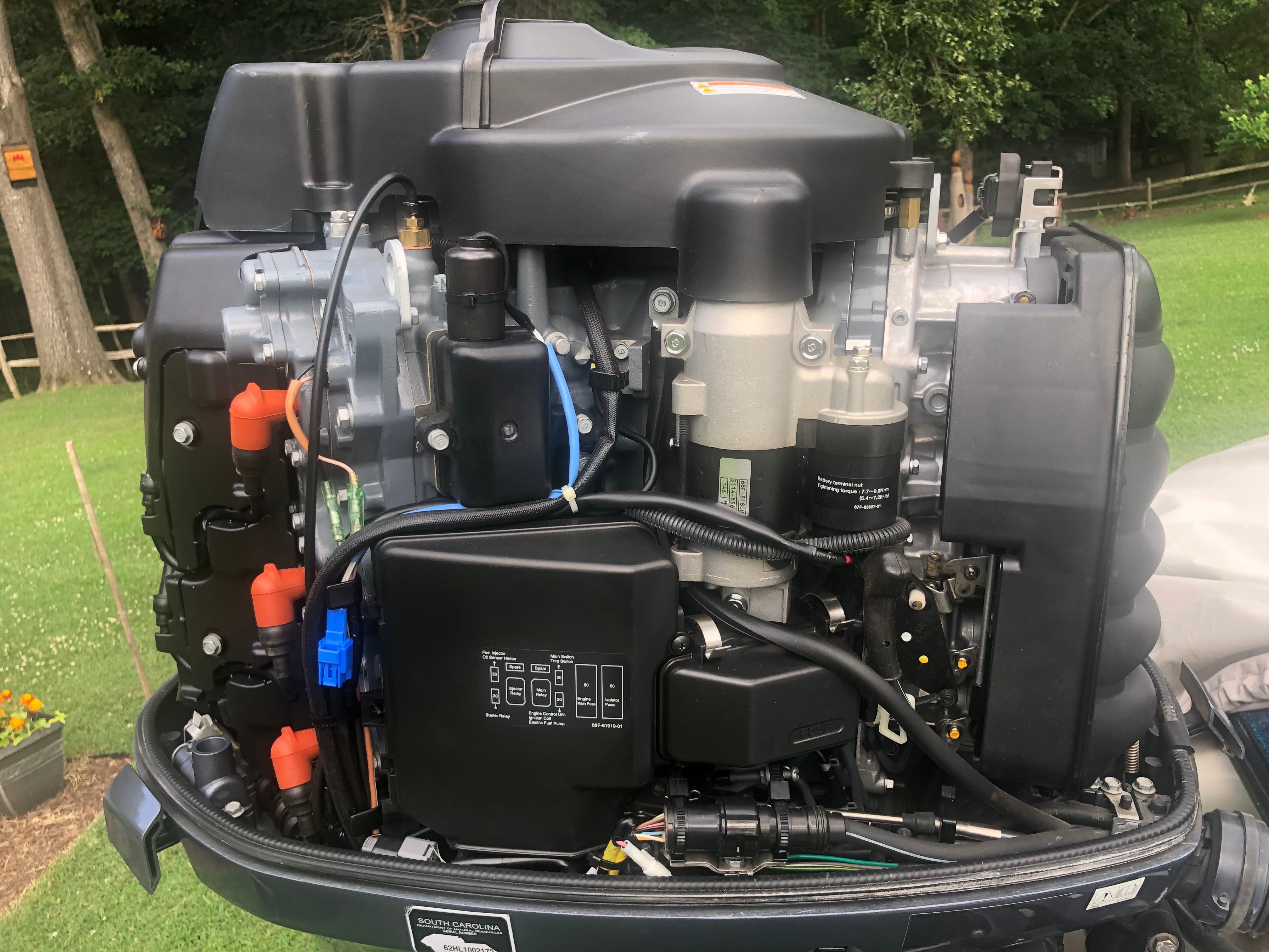 The engine of a 2012 Skeeter ZX190 boat is visible outdoors.