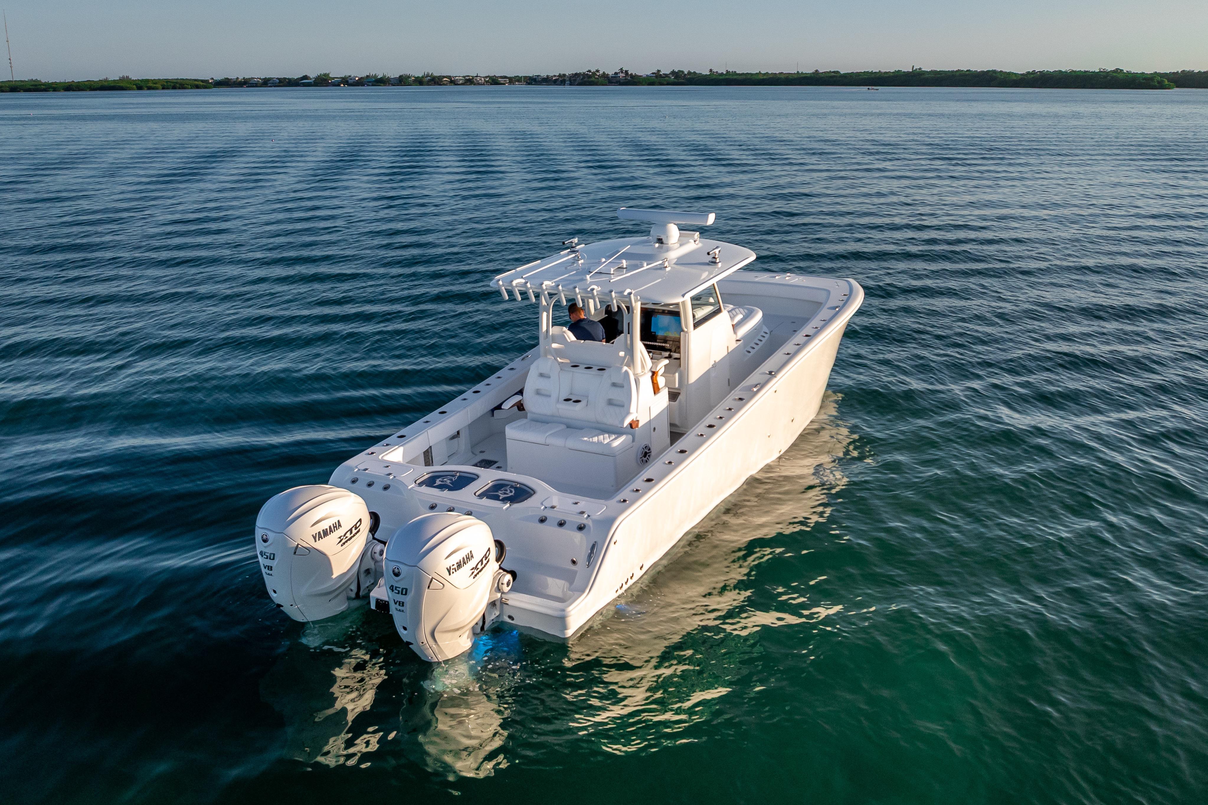 2026 Freeman 35 boat with dual Yamaha engines cruising on calm water.