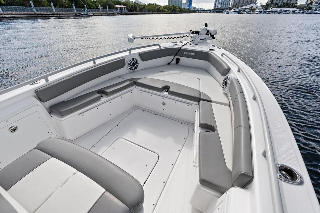 2023 Everglades 243 Center Console boat interior with gray seating on calm water.