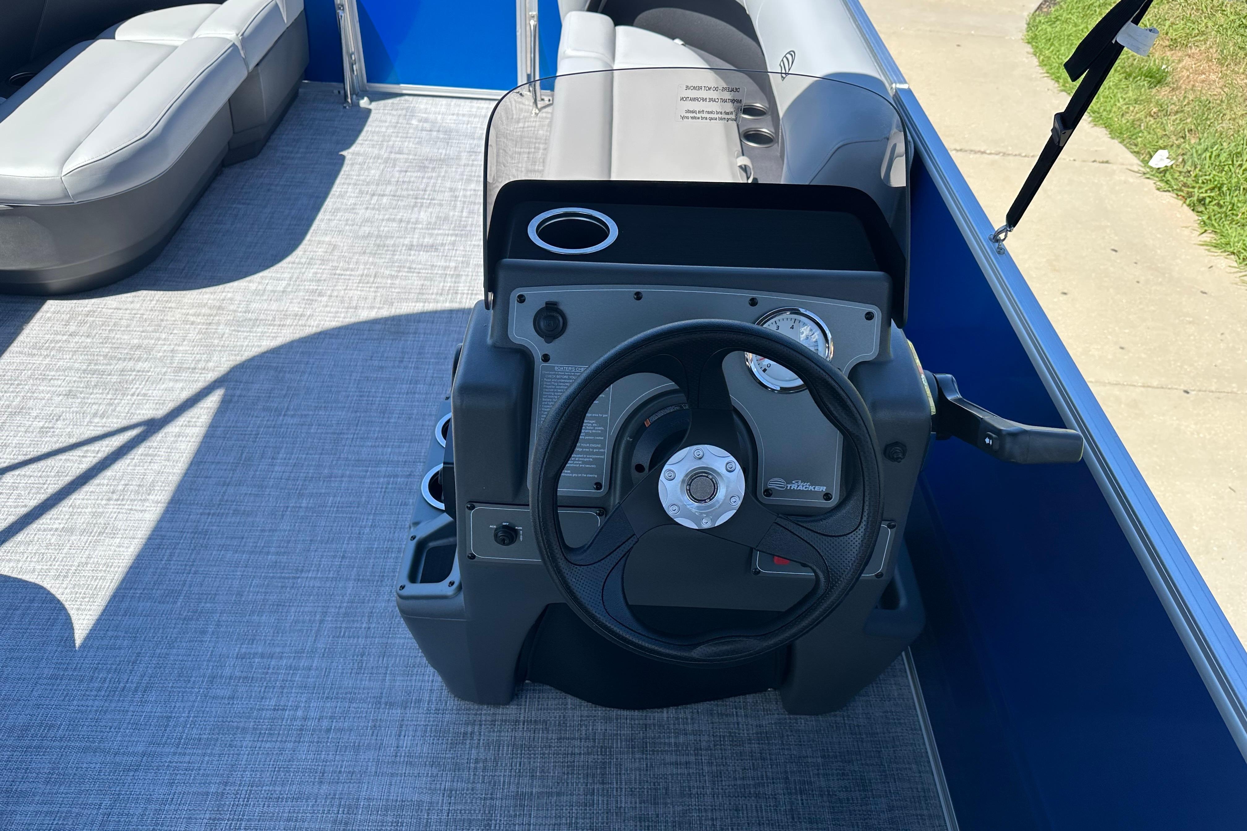 Steering console of 2026 Sun Tracker Party Barge 16 DLX pontoon boat.