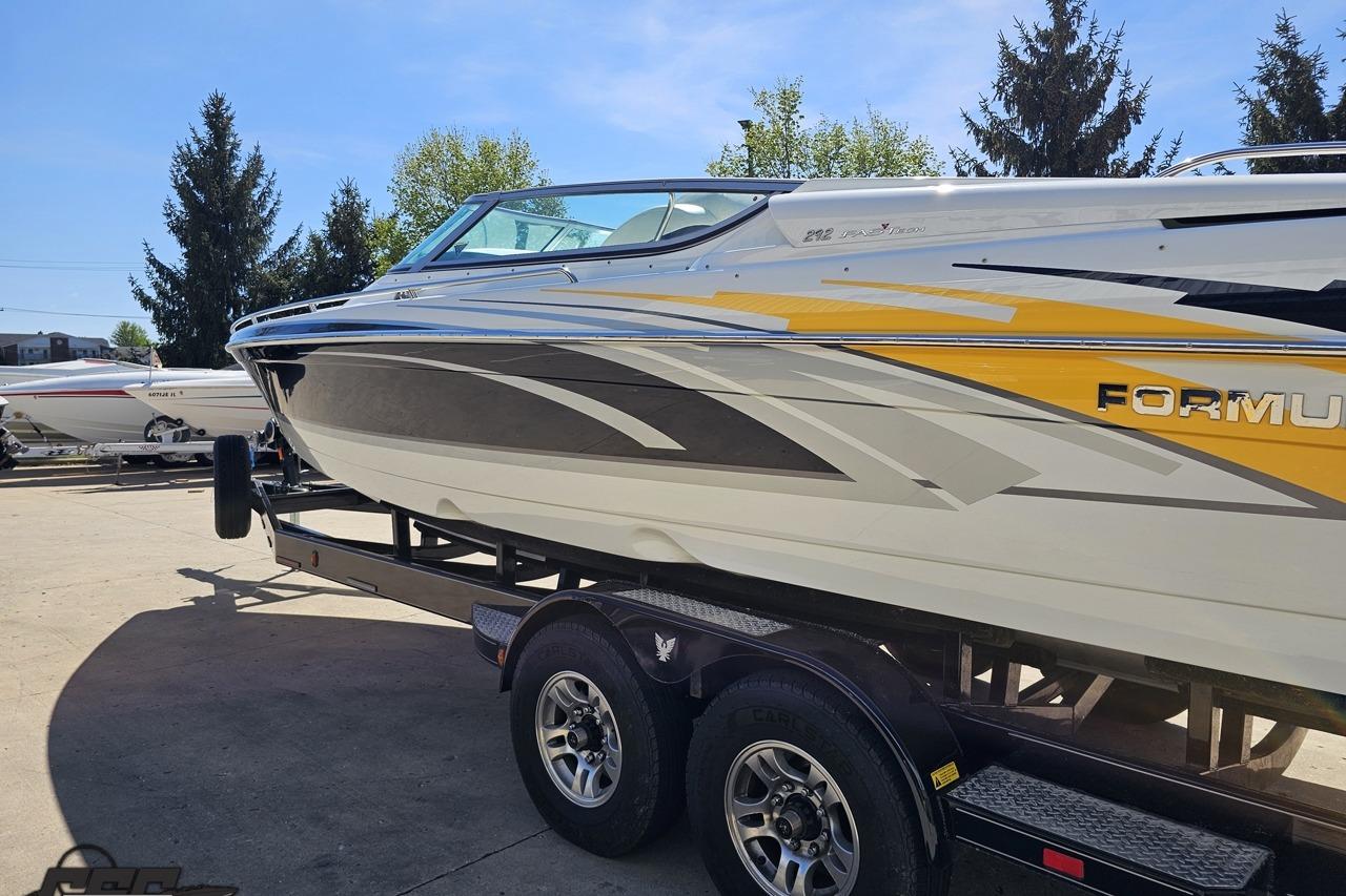 2014 Formula 292 FASTech boat on trailer, featuring sleek design and vibrant graphics.